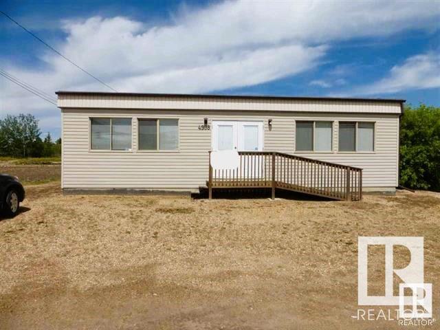 979 sq ft free standing building located on a very busy street in the Village of Thorsby. Parking is located in the front of the building. It is a modular on a cement foundation with crawl space and is wheelchair accessible. Building has a front reception area, large main display area, separate lunch room and a 2 piece bathroom. No natural gas, all electric heat. Central air conditioning. Renovations done in 2005. Building is in good condition and could be used as office for rental business or rented out. Approximate age of modular is 2000. 16 unit mini storage bays (4- 10x30, 2- 10x20, 8- 10x15, 2-10x10)  All units are currently rented out and provide $2420 per month in income. 3010 sq. ft. of building space. Fenced yard. Zoned DC. A second building can be constructed from the materials included on site.