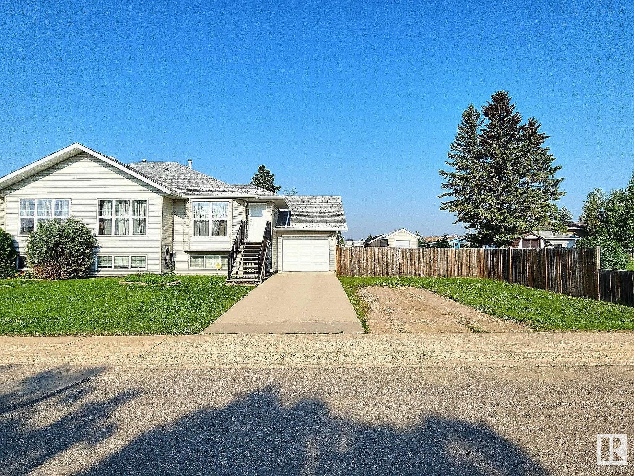 Amazing Starter Home! This duplex was built in 2007 and is located across the street from a park, close to shopping and the St. Paul Golf Course. The main floor has an open design with ample natural light, a large main bedroom with ensuite, a second bedroom, a four-piece main bathroom, and main floor laundry. The fully finished basement has a large bedroom, a three-piece bathroom, and ample open living space. This home has an attached single-car garage that is large enough for your vehicle and storage. The yard has a covered patio off the back of the home with a wood fence that offers excellent privacy for when you sit around the fire pit.