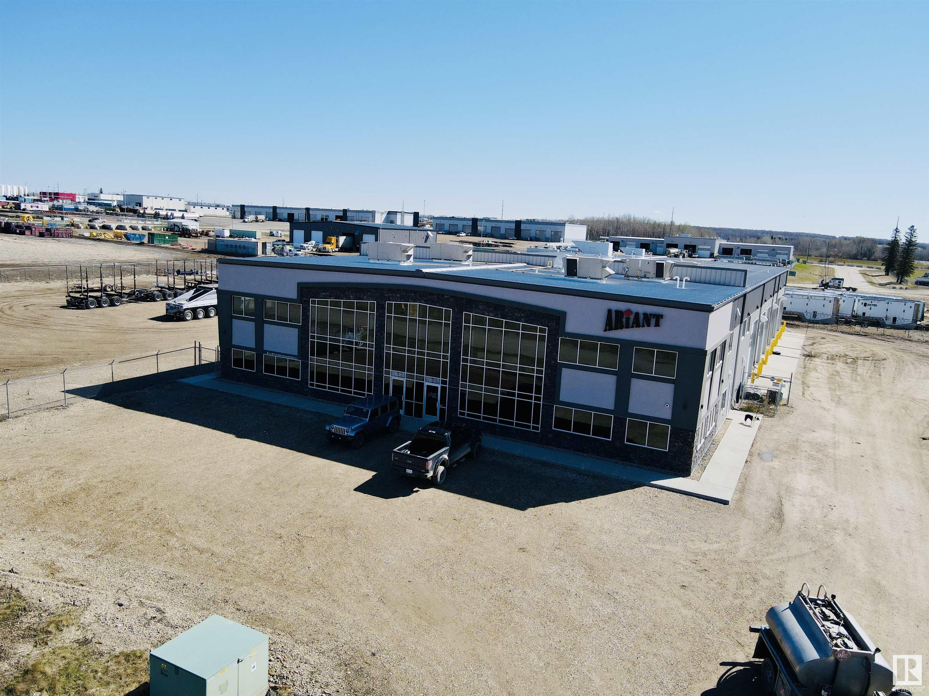 Conveniently located in Brazeau Business Park in Drayton Valley, this property offers 4,933 sq ft of office space with options for drive through shop use (two, 100'x22' bays with 16'x16' overhead doors), gated/secured yard, and parking garage. The office space has 9 offices, a large board room, 2 washrooms, kitchen areas, storage room, workout room, and storage mezzanine. Additionally, a full drive-thru wash bay - 100'x25' is available for use. Many options to choose from, including lease of only half of the second floor, all of the second floor, or half of the main floor.