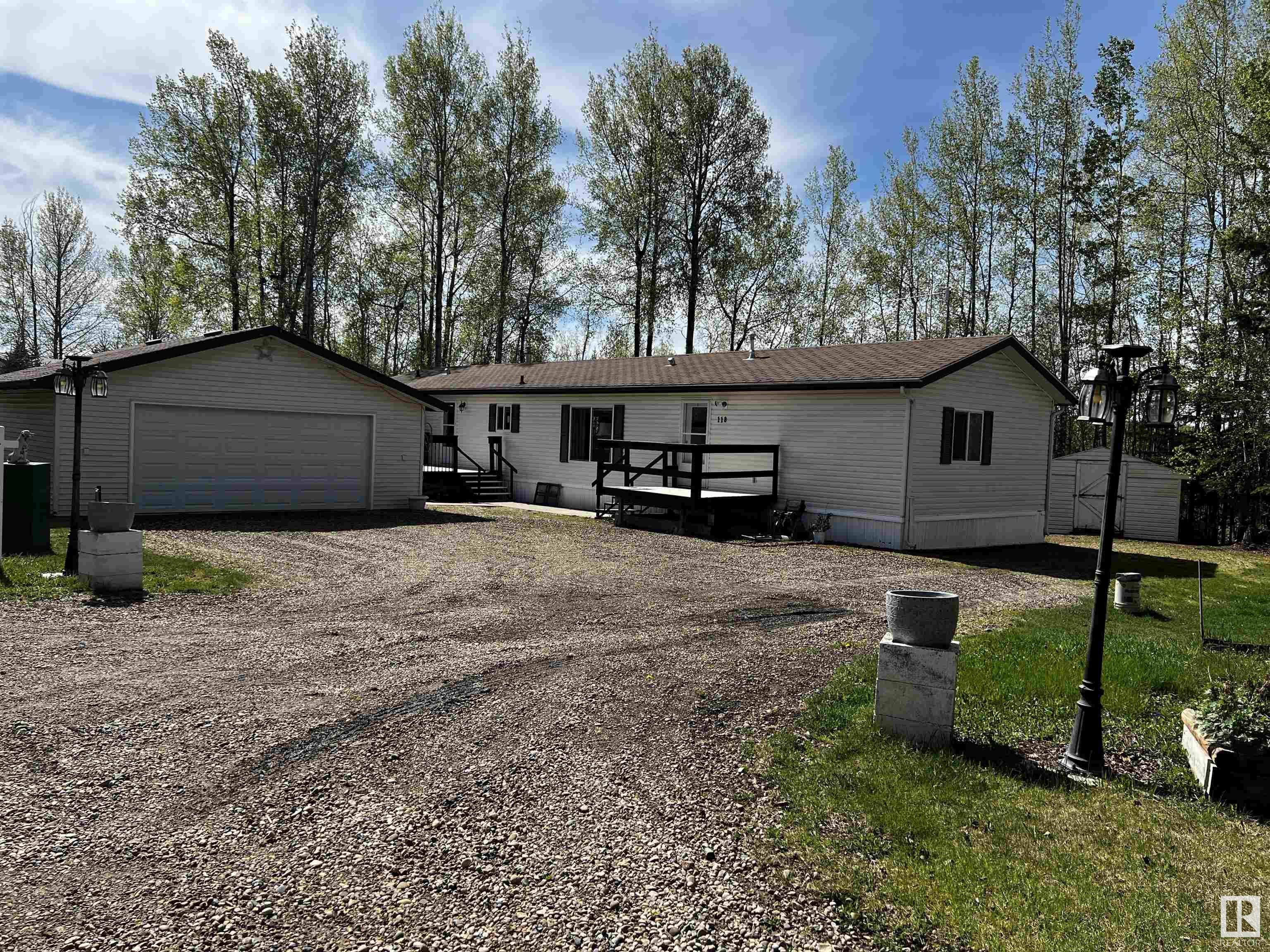 Birchwood is a beautiful place to call home! You not just own your home, you also own your lot. You are on a golf course & you have a private setting with access to a club house for members as well as the Golf course club house that also has a lot of amenities. Socialize in the lounge, restaurant, golf simulator. There is a pro shop, motel for guests, banquet room. The setting for this home is perfect with lots of trees for privacy. Inside you will be pleased with the 3 bedroom home with walk in closets in 2 rooms, 2 bathrooms, vaulted ceilings, island, walk in pantry, huge laundry/ storage room & open office desk area. The back deck is 16x14 and backs onto trees. In front are 2 more decks, a 24x24 detached garage. The condo association has set up a ball diamond, horse shoe pits & access to their clubhouse with kitchen for any special events you would have access to. The members will also put on pot luck evenings, get together for cards etc. There is a great playground area for the kids with equipment.