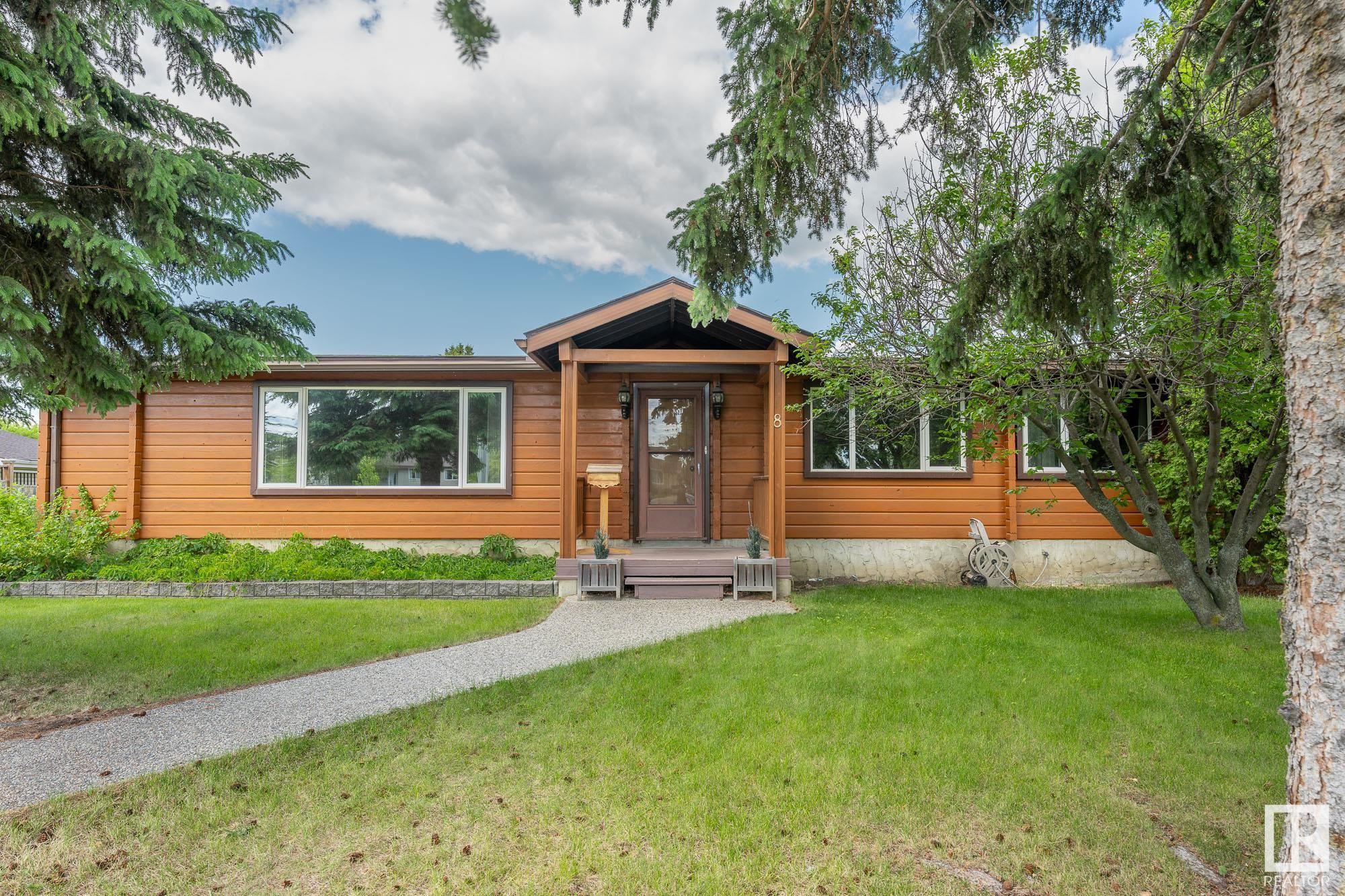 Welcome to this beautiful and rare cedar log home nestled in a great cul-de-sac location in Stony Plain. Quality built and hand assembled by the original owner with only the finest cedar logs from BC, this wonderful family home features over 1600 sq/ft on the main floor with 3 bedrooms, 1.5 baths, an inviting living room with an expansive window, well appointed kitchen next to the formal dining area, a spacious mudroom leading to an impressive wrap around deck, large double oversized detached heated garage, ice melt system on roof, complete appliance package plus so much more. Great location close to schools and many local amenities this one of a kind home shows pride of ownership and is sure to impress!