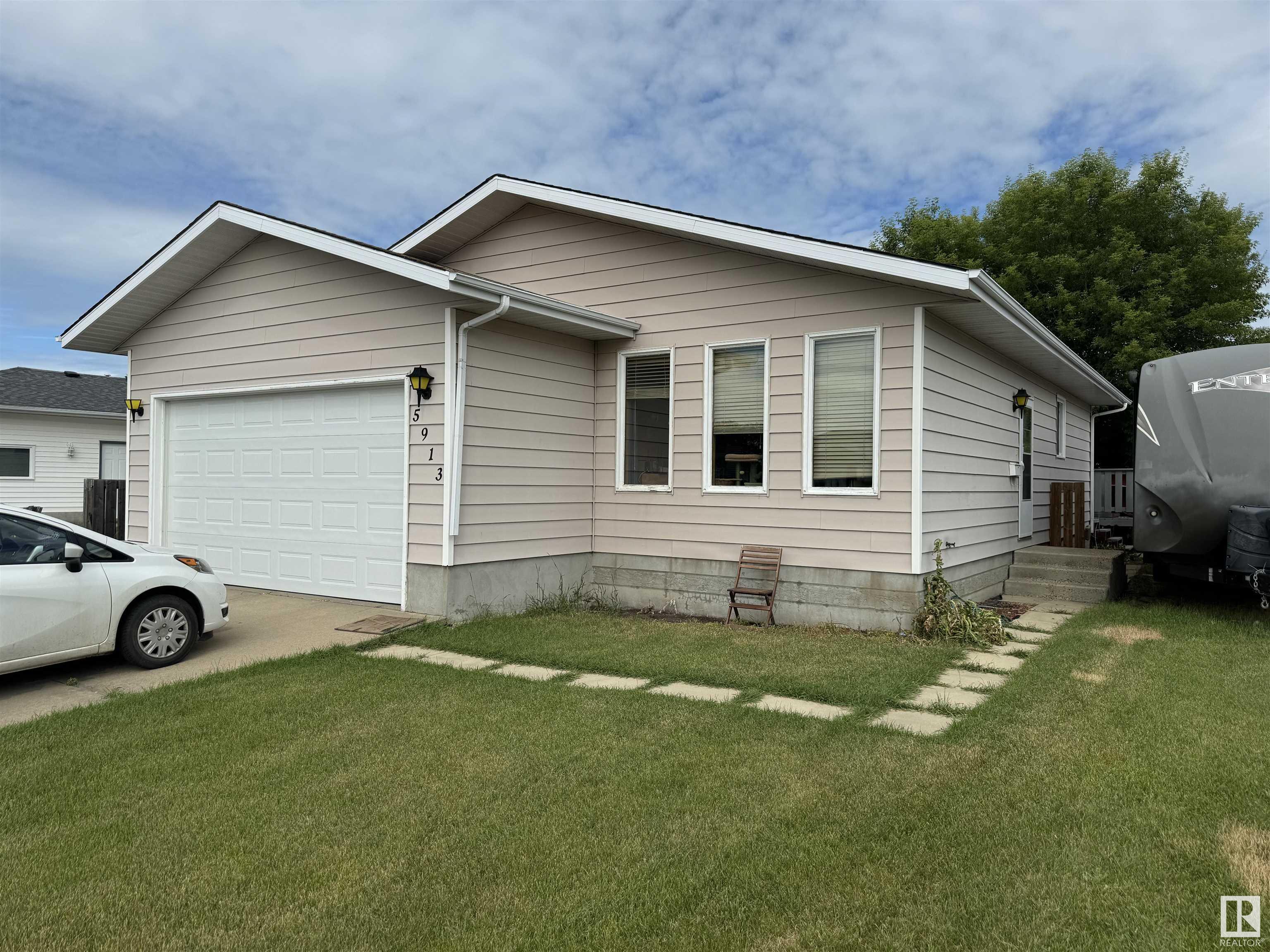 Check out this 5 bedroom house located close to parks in north Vegreville.  This home features large living room, spacious kitchen with dining area, 2 rec rooms, with plenty of storage, laminate floors, attached garage, large deck, with lots of room to park your RV.  Ready for a new family to make this place home!