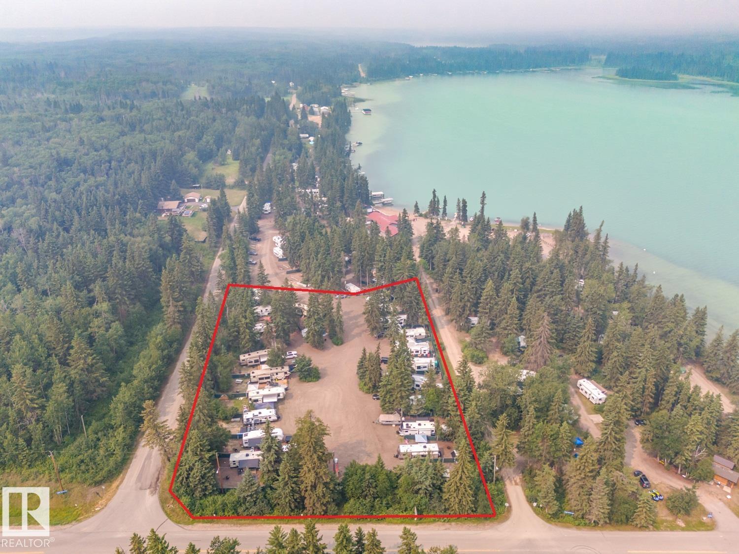 Prime Location at Crane Lake! This is your opportunity to own your own piece of Bodina Resort! This privately owned campground is situated on 1.61 Acre Parcel and offers 20 private fully serviced camp sites with power gas water and sewer connections, majority of clientele is seasonal rentals from May long weekend to September long weekend at $4000 per site with an optional $500 fee to store the unit on site for the winter months as well. Bodina Resort at Crane lake has been a destination for families for decades with a solid clientele list there is rarely an open site available! Visit and you'll see why; with mature spruce trees, fire pits and picnic tables, privacy fencing and paved walkways are already in place, the work is done! Come and own your own business and enjoy the summer at one of the nicest lakes in the Lakeland! Can be sold in conjunction with the store and house, shop, garage, bunkies, and dry lakefront cabin complete with 15 more campsites!! Check out MLS E4399427 for additional details!