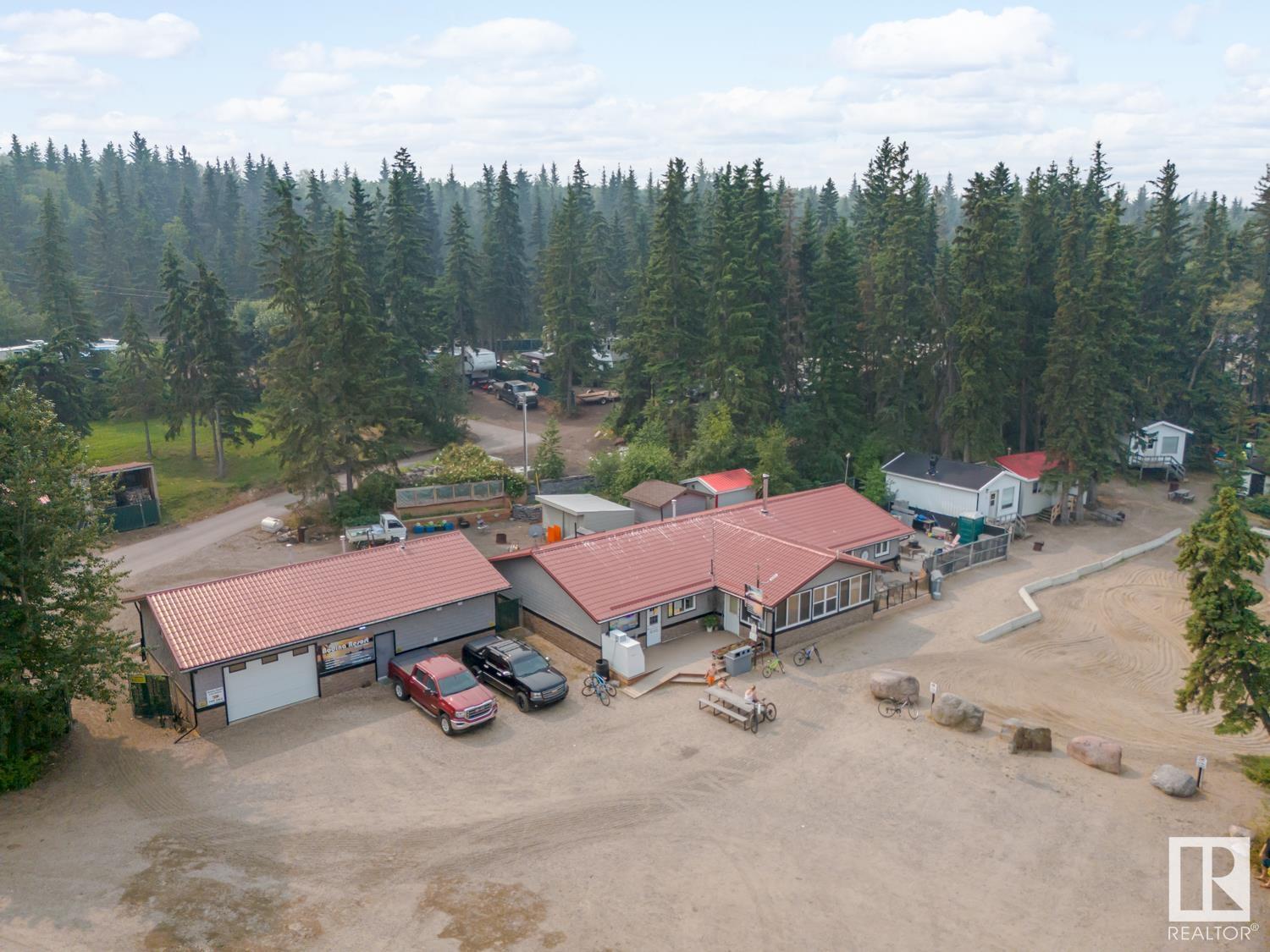 Bodina Resort at Crane lake has been a well established campground and recreational destination for decades. Now is your chance to a 2.17 acre piece of this renowned lakefront. This is truly a live and work setup. This property is comprised of the 2400 sq.ft main house and store which have seen many up grades throughout the years. Two bunkies, 20 x 32 Shop, 42 x 26 Garage with bathrooms and laundry facilities, and a dry cabin and 15 full service campsites which are typically booked for the full season. This lakefront home is well appointed with 3 bedrooms including primary with newly refurbished 3 piece bath, 4 piece main bath, office, living room that overlooks the lake with wood stove, Kitchen with new custom hardwood cabinetry with quartz countertops and eat at peninsula, mainfloor laundry, bright dining room with panoramic lake views with access out on to the deck and fenced stamped concrete firepit area. Can be sold with the adjacent parcel with 20 more campsites! Check out MLS E4399409 for details!