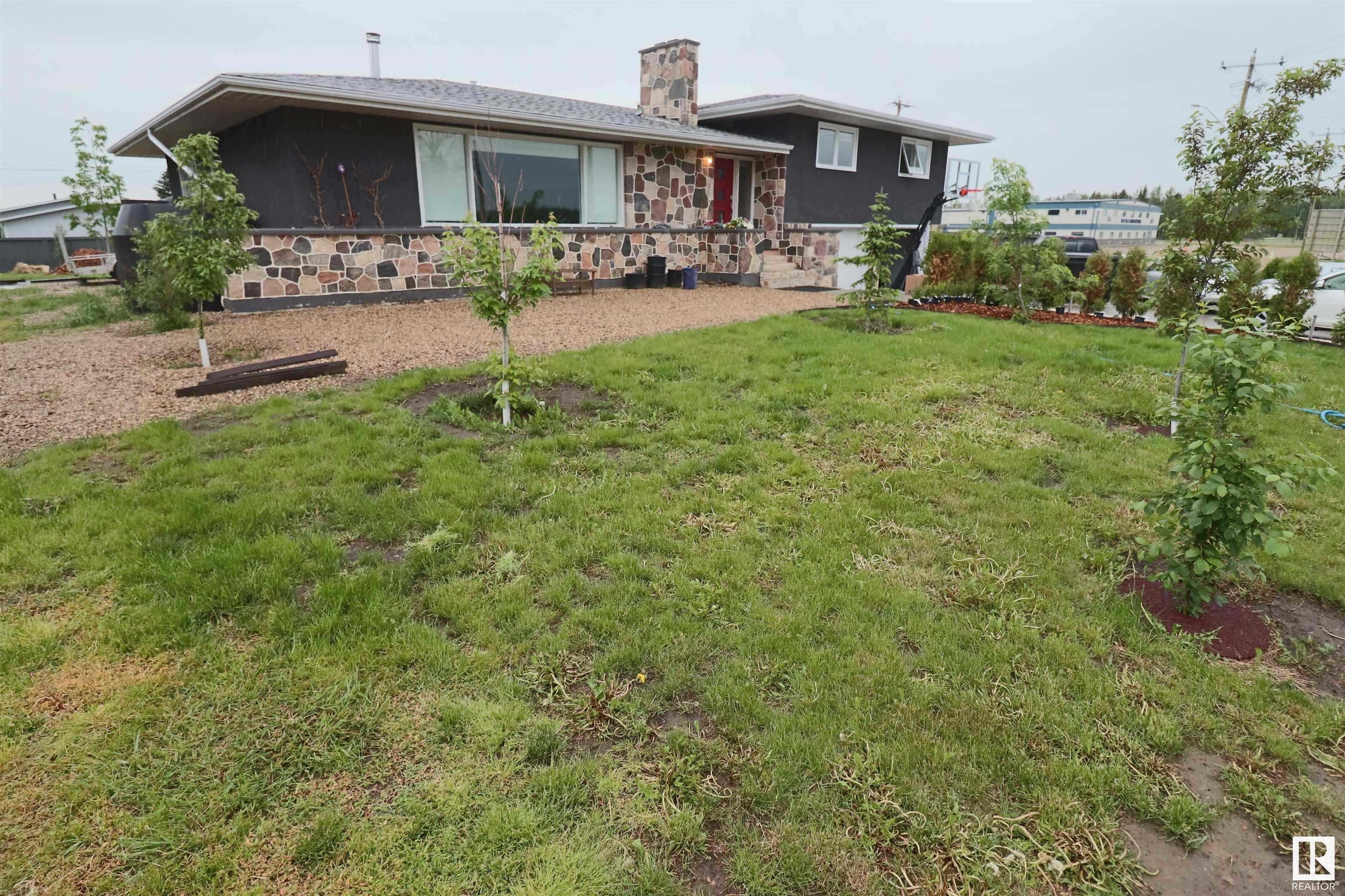 What a find - A pristine 6 bedroom, 4 bath 2050 SQ. FT.  home with extensive upgrades including: all new triple pane windows on main floor and up, new island kitchen with granite countertops, new expansive white cupboards, new appliances, " Invincible" vinyl flooring throughout main floor, 95% high efficiency furnace, hot water tank, electrical upgrades throughout, paint interior - exterior, new Garage doors, 45 year shingles, 3000 SQ. Ft. of poured driveway and RV pad, new fencing. The huge foyer invites you into the open concept floor plan with living room, brand new insert fireplace, adjoining family area, and dining area leading to the bright open kitchen. Upstairs, enjoy 4 bedrooms and upgraded 3 pce bath along with laundry area. Main door to the oversized double garage that will fit 3 vehicles. The reno'd basement is fully finished with rec room, 2 bedrooms, 3 pce bath, utility / laundry area, and a full second kitchen. The huge double lot has rear lane access and a very private rear yard. BEAUTY
