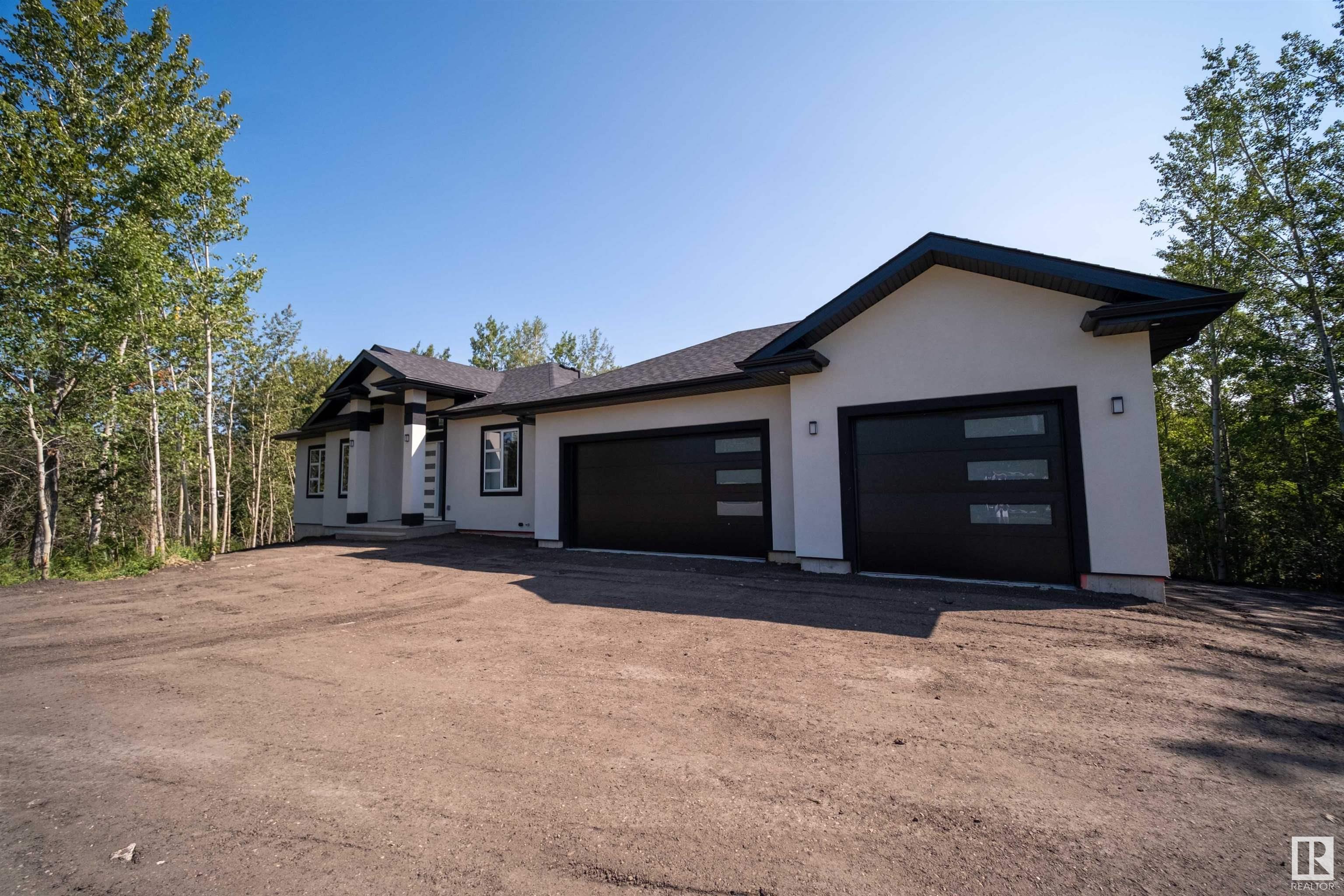 INCREDIBLE BRAND NEW BUNGALOW. WELCOME TO LOT 353, 50419 RANGE ROAD 203 , BEAVER COUTY, AT BEAVER CREEK ESTATES. THIS BRAND NEW 2024 HOUSE HAS 1646 SQFT OF MAIN FLOOR AND AN UNFINISHED BASEMENT FOR YOUR OWN DESIGN AND CREATION. 3 BEDROOMS AND 2 BATH AT MAIN FLOOR. THE OPEN KITCHEN HAS SOFT CLOSE CABINETRY , QUARTS CANTERTOPS, SOFT VINYL FLOOR, A 8*4 ISLAND WITH SINGEL LEVEL EATING BAR, ILE BACKSPLASHAND A CORNER PANTRY. DINNING NOOK IS OPEN CONCEPT WITH EXERIOR DECK ACCESS. LIVING ROOM HAS AN ELECTRIC BUILT IN FIREPLACE. THE MASTER BEDROOOM HAS AN OVER SIZED WALK IN CLOSET . ENSUITE HAS A DOUBLE SINK , TUB AND 3*5 SHOWER . ON THE MAIN FLOOR ARE 2 ADDITIONAL BEDROOMS AND FULL BATH. GAS HEATED TRIPPLE CAR GARAGE WITH 950 SQFT , MUD ROOM WITH OWN CLOSET . DECK IS 25*12 , SEPTIC TANK + TREATED MOUNT SYSTEM WITH 30 YEARS WARRANTY , HOUSE IS NEW HOME WARRANTY. Virtual Staging completed.