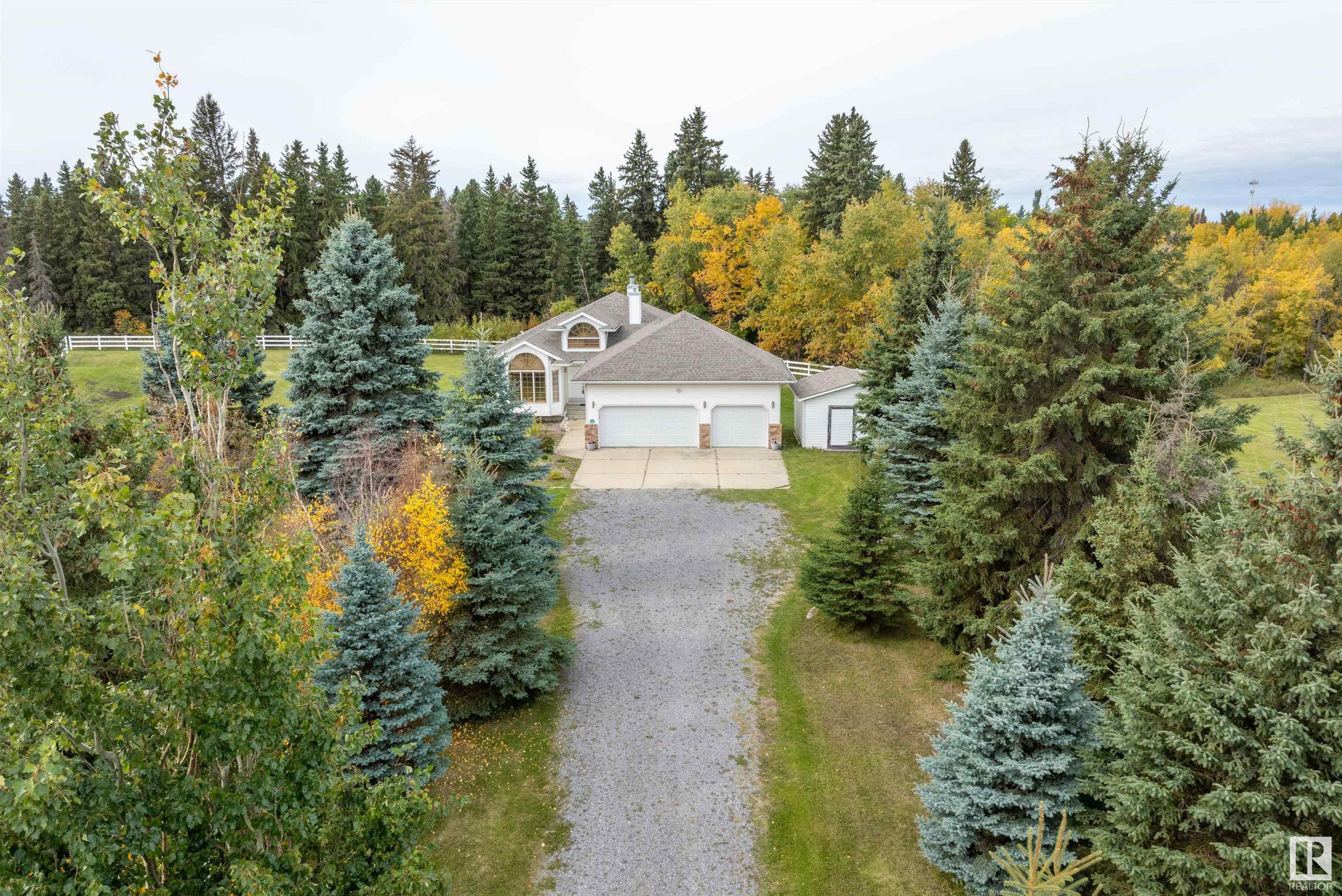 Opportunity to own a beautiful home & 2.09 PERFECT ACRES in Wetaskiwin County that wraps around the RAVINE and GORGEOUS TREED RESERVE that is the PIPESTONE CREEK as it winds thru Millet and is the natural south border of the Town. Treed perimeter, fenced in WHITE PVC FENCING and lovingly maintained, STEP BACK IN TIME into this 1691 sq. ft. BUNGALOW that offers a FULLY DEVELOPED basement, west SUN ROOM and deck and features a finished TRIPLE ATTACHED GARAGE. Vaulted ceilings, central staircase, FORMAL DINING ROOM, main floor DEN/OFFICE at the front door, 2 bedrooms up and 3 bedrooms downstairs plus 3 bathrooms. Spacious gathering areas in the GREAT ROOM with WOOD BURNING FIREPLACE & LOG LIGHTER & the large lower FAMILY ROOM/GAMES ROOM with WOOD BURNING STOVE! All this and more plus a DRILLED WELL & HOLDING TANK! This UNIQUE LOCATION offers so many possibilities, from simple COUNTRY LIVING with all the amenities the area has to offer to a thriving HOME BASED BUSINESS this could be the PERFECT ACREAGE.
