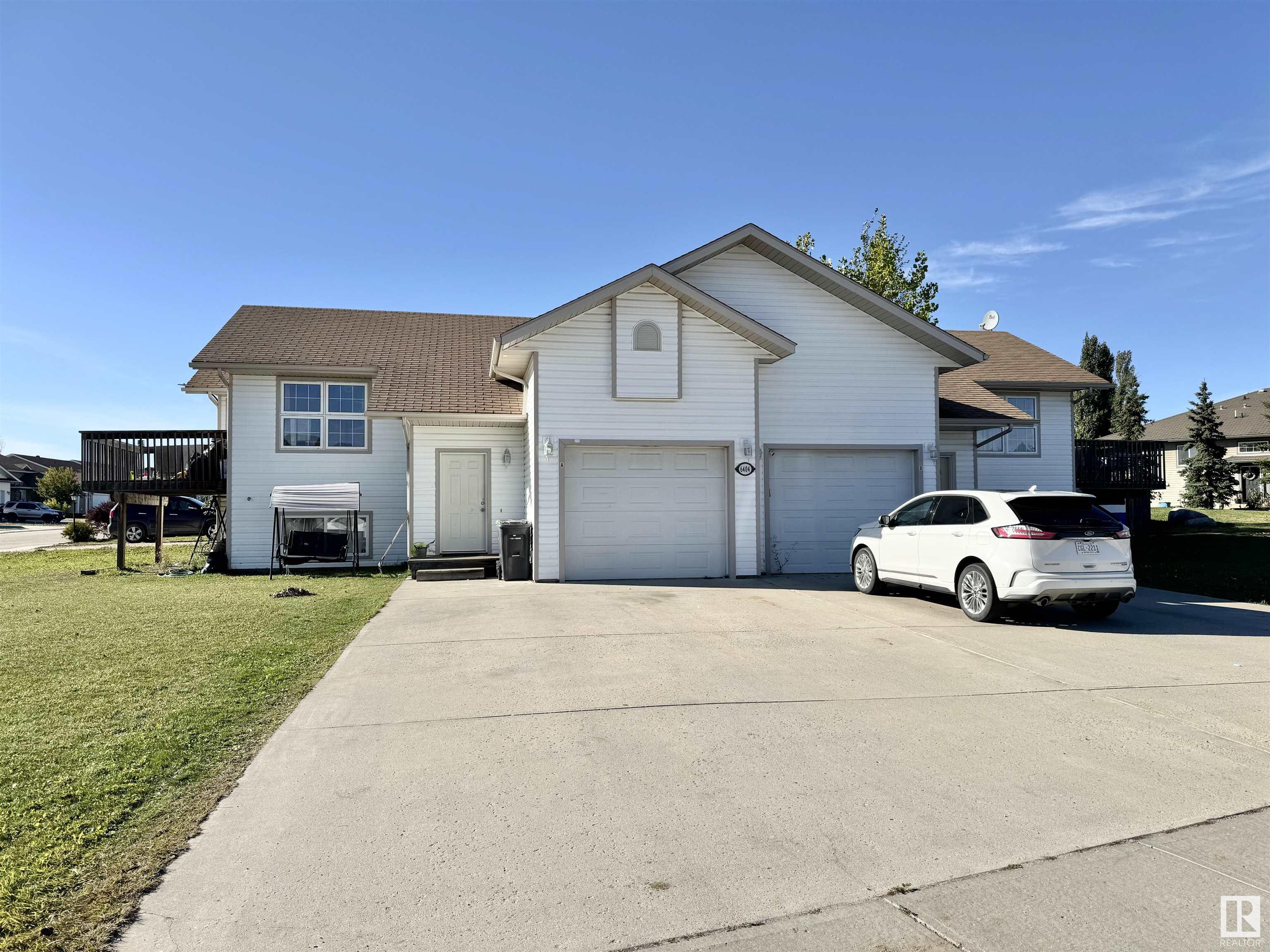 Great investment opportunity!  Welcome to this charming full duplex, new living area PVC Laminate and freshly painted, perfectly designed for modern living. The main floor boasts an open-concept living area, seamlessly integrating the kitchen, dining, and living spaces, ideal for everyday living. The primary bedroom is conveniently located on the main floor, offering privacy and ease of access. Descend to the lower level to find two additional spacious bedrooms, perfect for family or guests. This level also features a cozy family room, a well-equipped laundry room, and a full bathroom, providing all the comforts and conveniences you need. Additionally, each unit includes a garage and a large concrete driveway, providing parking for up to two more vehicles per unit. Don?t miss the opportunity to make this versatile and inviting home yours and/or your tenants. If buyer is GST reregistered, no GST is needed and price will be reduced accordingly