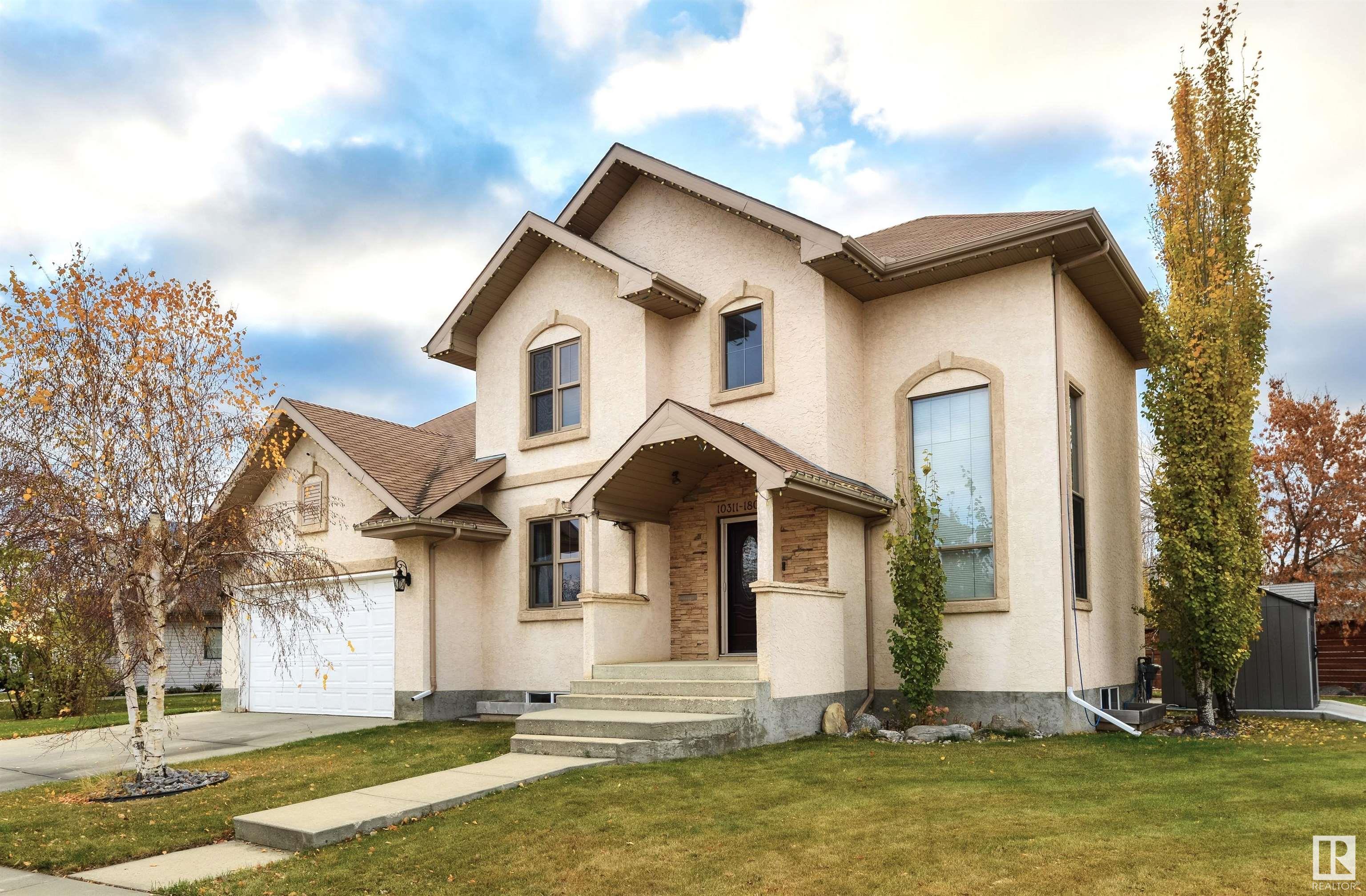 Absolutely stunning one of a kind 3 bedroom+ den, 2.5 bathroom 2 storey home situated on a large lot backing onto walking trails. As you enter this beautiful home you are greeted by a stunning grand entrance with soaring ceilings. Large unique beautiful kitchen with dinning space for 20+ guests that features a custom fireplace. Embrace all the natural light from all the windows! Gleaming hardwood floors and beautiful porcelain tiles throughout the main floor. There are french doors leading off the kitchen to the office/den.  All 3 bedrooms upstairs are a good size. The master bedroom features a large ensuite & huge walk-in closet. The back entrance comes with a good sized mudroom. The basement comes with a family room, separate entrance from the garage, has major potential, and is awaiting your imagination. Enjoy the nicely lanscaped lovely south facing private backyard. New fence and lots of parking space. Great location steps from transit, close to schools, amenities, and the Anthony Henday. Won't last.