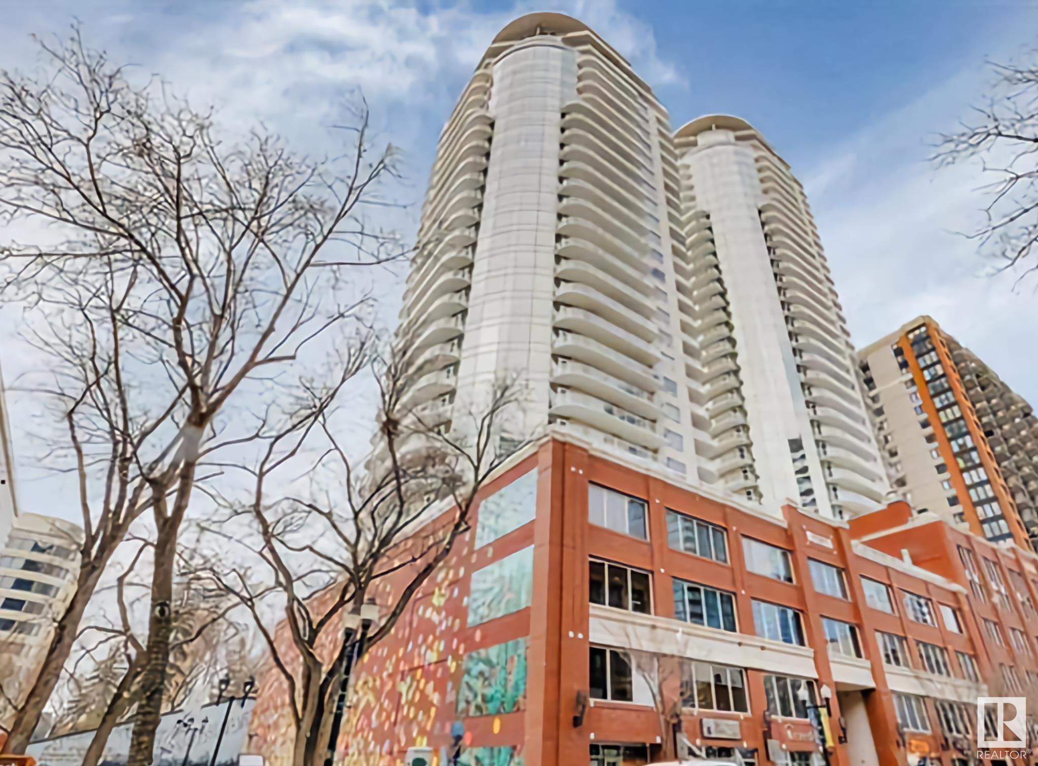 Breathtaking view of Downtown Edmonton and Roger's Place. This spacious 2 bedroom and 2 bath home has many features that include: 9 foot ceilings, renovated 2 tone kitchen with quartz counters and equipped w/ Stainless Steel appliances, open bright floor plan with great flow, two large bedrooms, upgraded luxury vinyl plank (3 months old), walk-in closet, lots of storage, and a balcony with gas line. As for the location, you will find a grocery store, LRT, locally owned shops, cafes and restaurants just steps away.  Arts, Museum, Theatre, the Winspear, all steps away. Plus the River Valley is within walking distance and minutes away. The LRT connects  you in minutes to the U of A, and NAIT, walk to Grant MacEwan. Enjoy Edmonton's Downtown Farmer's Market Saturdays from May to Oct right out your front door. Located in the sought after 104 Street Warehouse District; one of Edmonton's best streets with a WALK SCORE of 98/100, recognized as one of Canada's top Streets.
