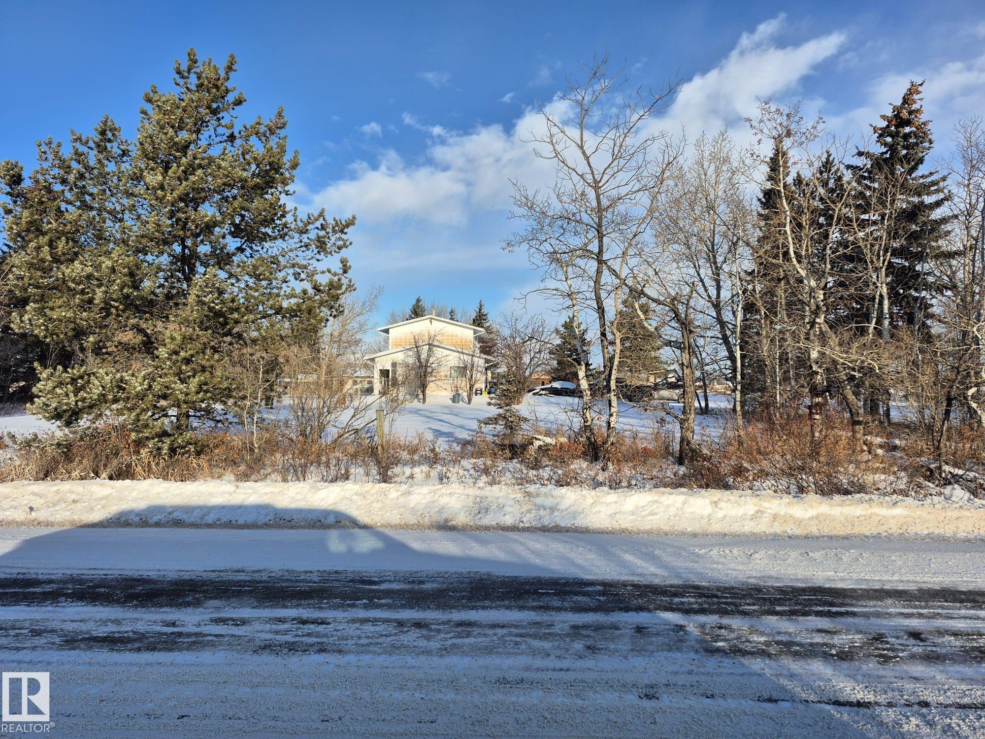 Prime North Edmonton Location ? 40 Acres on Pavement  Exceptional 40-acre parcel ideally situated on pavement just off 66 Street and Anthony Henday Freeway. The west side features mature trees offering privacy and natural beauty, while the east half is in productive crop. Includes an older two-story home with full services and an older shop. Perfect setting for estate living, a hobby farm, or a home-based business.