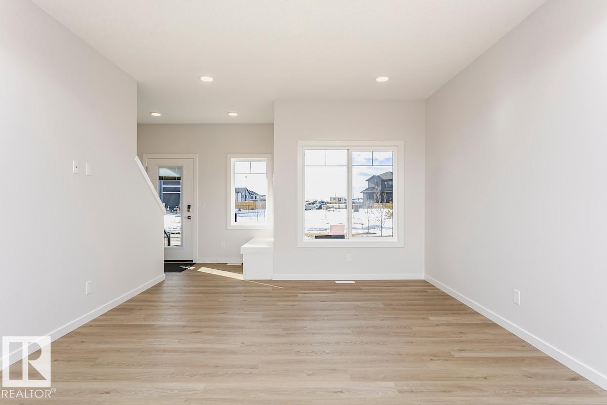Photo 2 at 310 Hawthorn Way, Woodbend, Leduc
