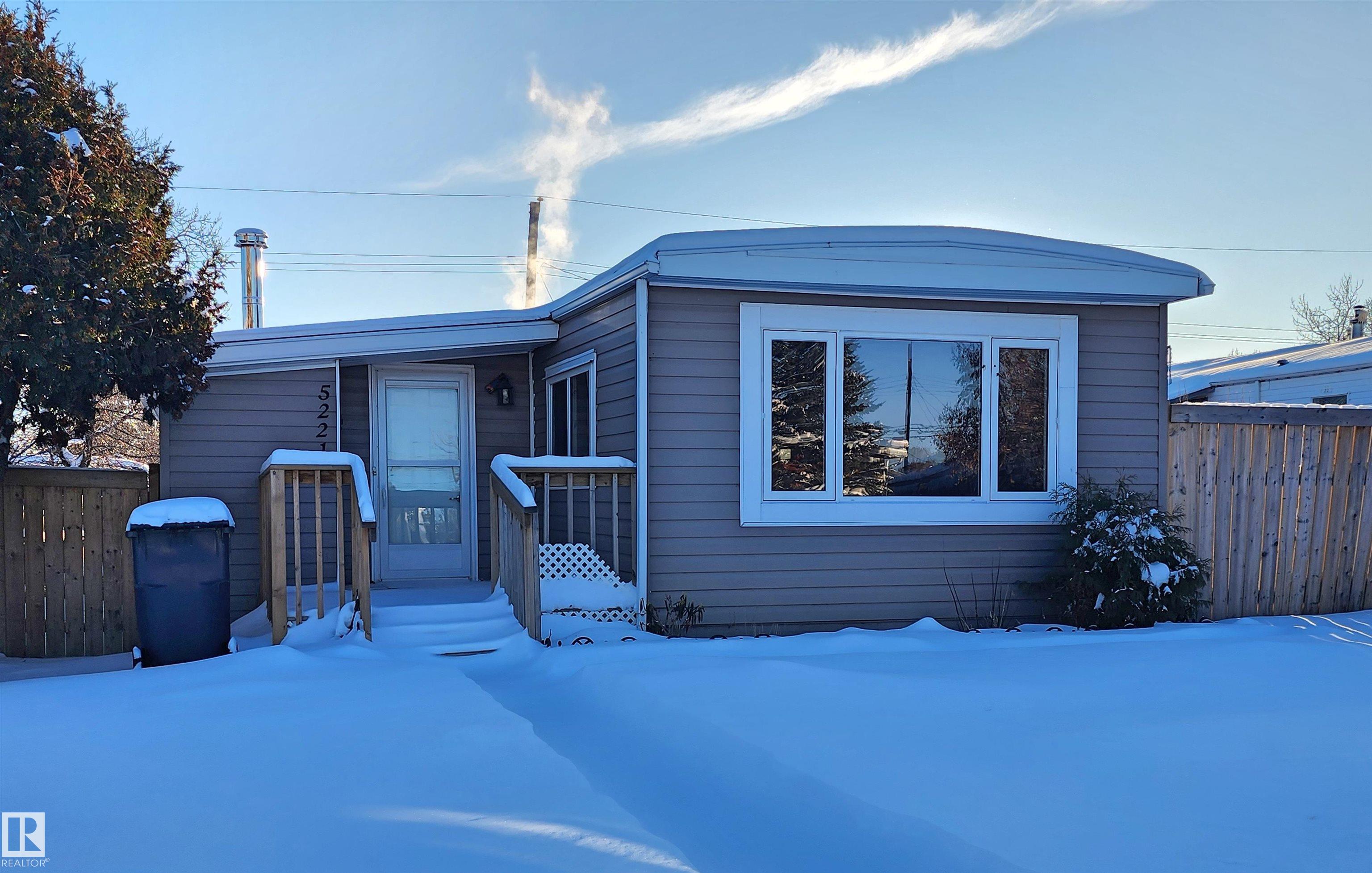 "Affordable & Updated Home on Owned Lot" Discover comfort & value in this well maintained mobile home with addition, situated on its own lot - no lot fees here.  Featuring newer flooring, this home offers a spacious functional kitchen with ample counter space, perfect for cooking & entertaining. With 2 bedrooms & 1 full bathroom it's an ideal starter home, downsizing option or investment property. The fully fenced yard provides privacy & space for kids, pets or gardening.