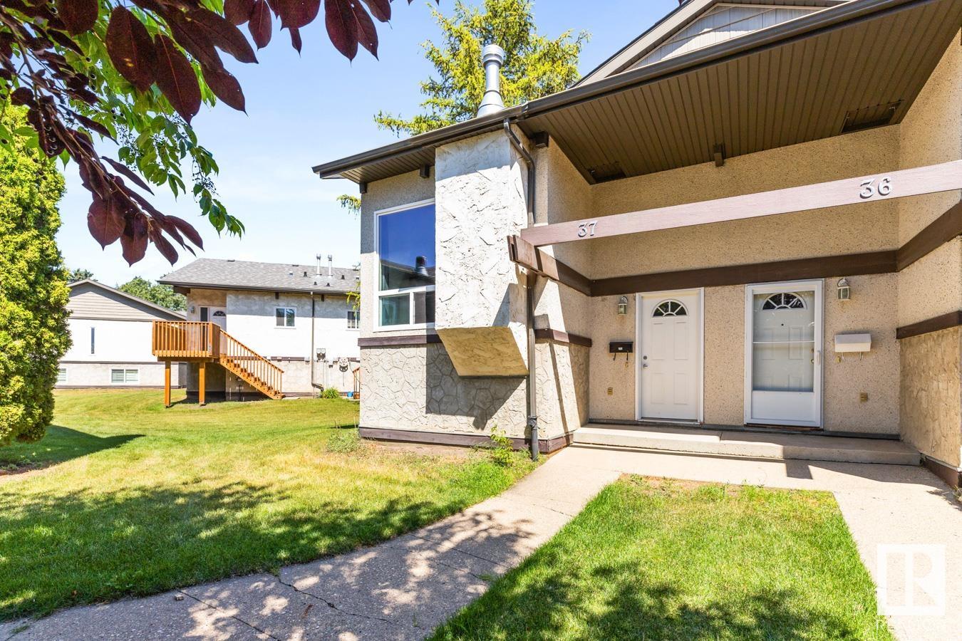 CAPTIVATING CAERNARVON!  Bi-level HALF-DUPLEX condo:  2-BEDS, a LOFT & 1 BATH now available!  Over 1,000 sq ft of living space w/ plenty of storage space.  The main floor has vaulted, wood ceilings and beams.  Entire home is CARPET-FREE.  Private, new, extended Deck. Upgrades include:  GAS FIREPLACE & NEW HOT WATER TANK (August 2025).  This is located a 10 mins walk away from the YMCA w/ fitness centre & pool, Skate Park, Spray Park, Skating Rink, Baseball & Soccer Fields and the Castledowns Twin Arenas. Many schools & parks/trails nearby. Groceries & Restaurants a short walk or drive away. Northwest location with easy access to the Yellowhead, Henday & Public Transit. Only a 20 mins drive to CFB / Edmonton Garrison.  Low Condo Fee INCLUDES WATER.  One assigned parking stall near the property. Pet Friendly Complex!