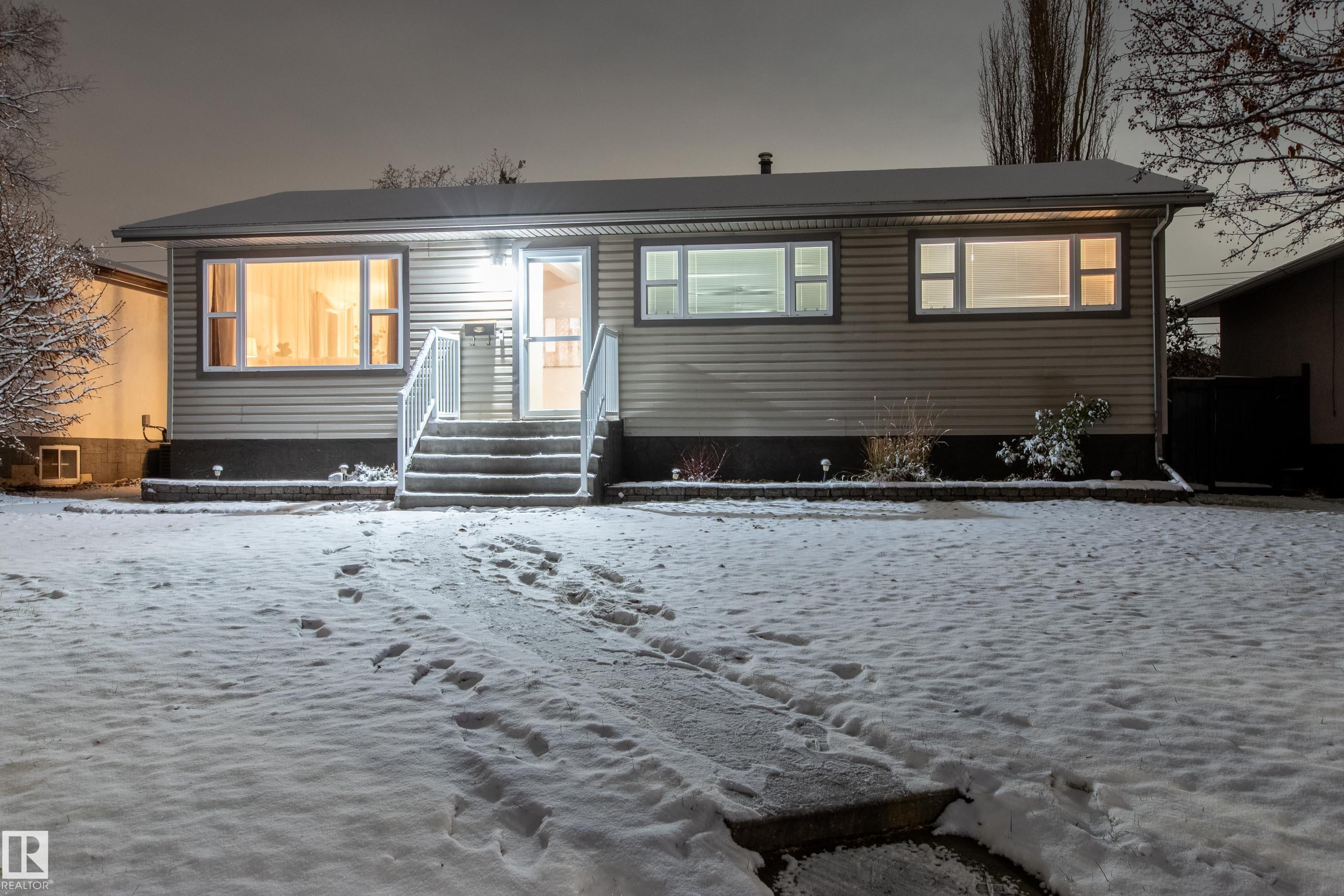 This renovated 1000 sq ft bungalow in Parkview feels instantly welcoming?bright, open, and full of charm. The main floor has three comfortable bedrooms, a stylishly redone 4-pc bath with a rustic-modern vibe, and a sunny kitchen that looks out onto the private backyard. Step outside to enjoy a large deck, landscaped gardens with Allan block borders, and a double detached garage. Downstairs, gather in the spacious rec room with its cozy gas fireplace, plus a 4th bedroom, 3-pc bath, and laundry. Practical updates?vinyl windows, newer roof, high-efficiency furnace, and central A/C?mean you can move right in. The location is hard to beat: walk to schools, playgrounds, BonTon Bakery, or Ichiban Sushi, and be downtown or on Whitemud in minutes. Parkview isn't just desirable?it?s a neighborhood you?ll love to call home.