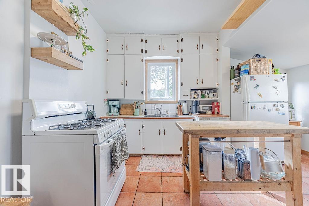 Photo 12 at 9833 83 Avenue NW, Strathcona, Edmonton