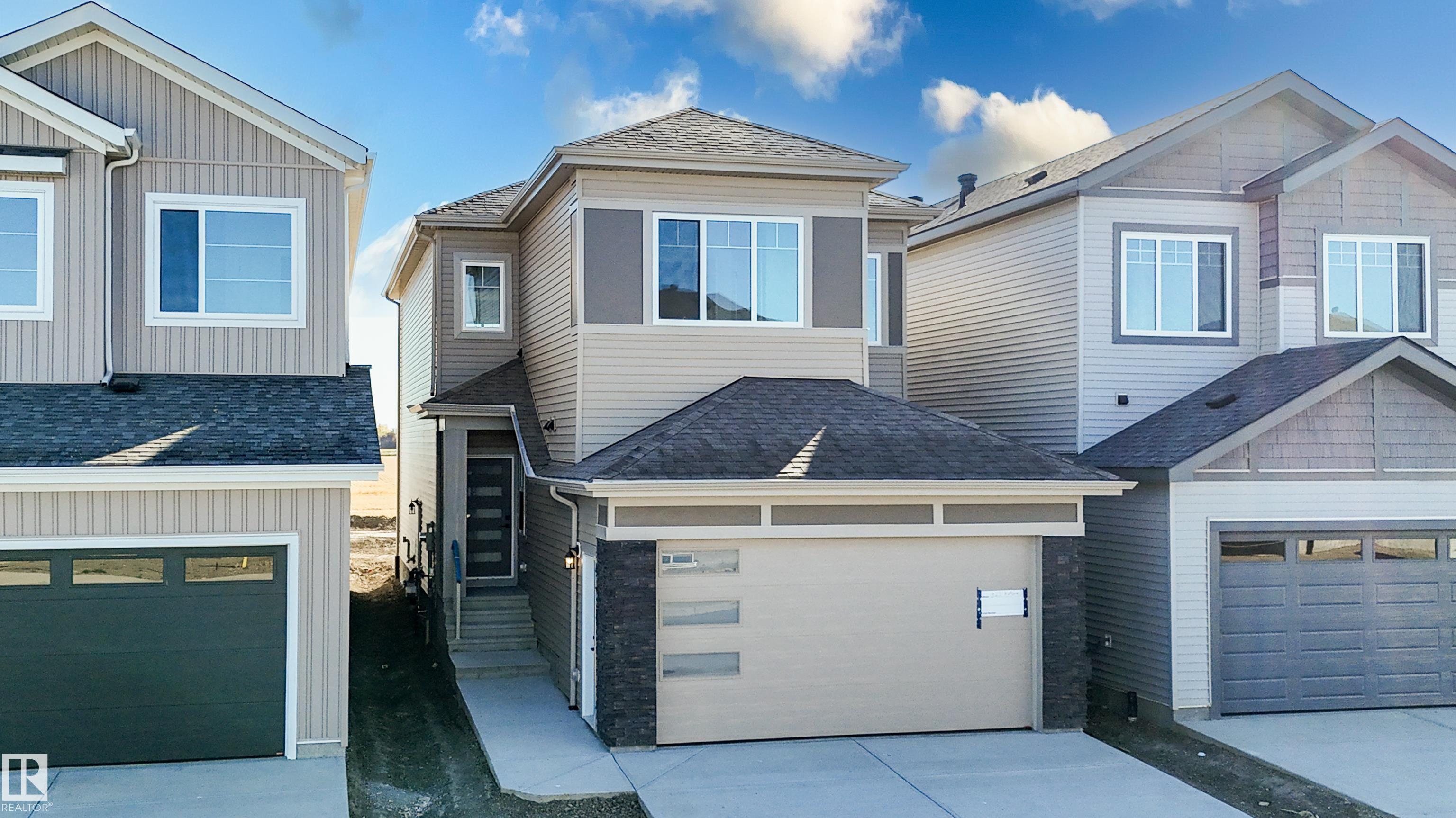 Photo 2 at 329 Bluff Cove, Black Stone, Leduc