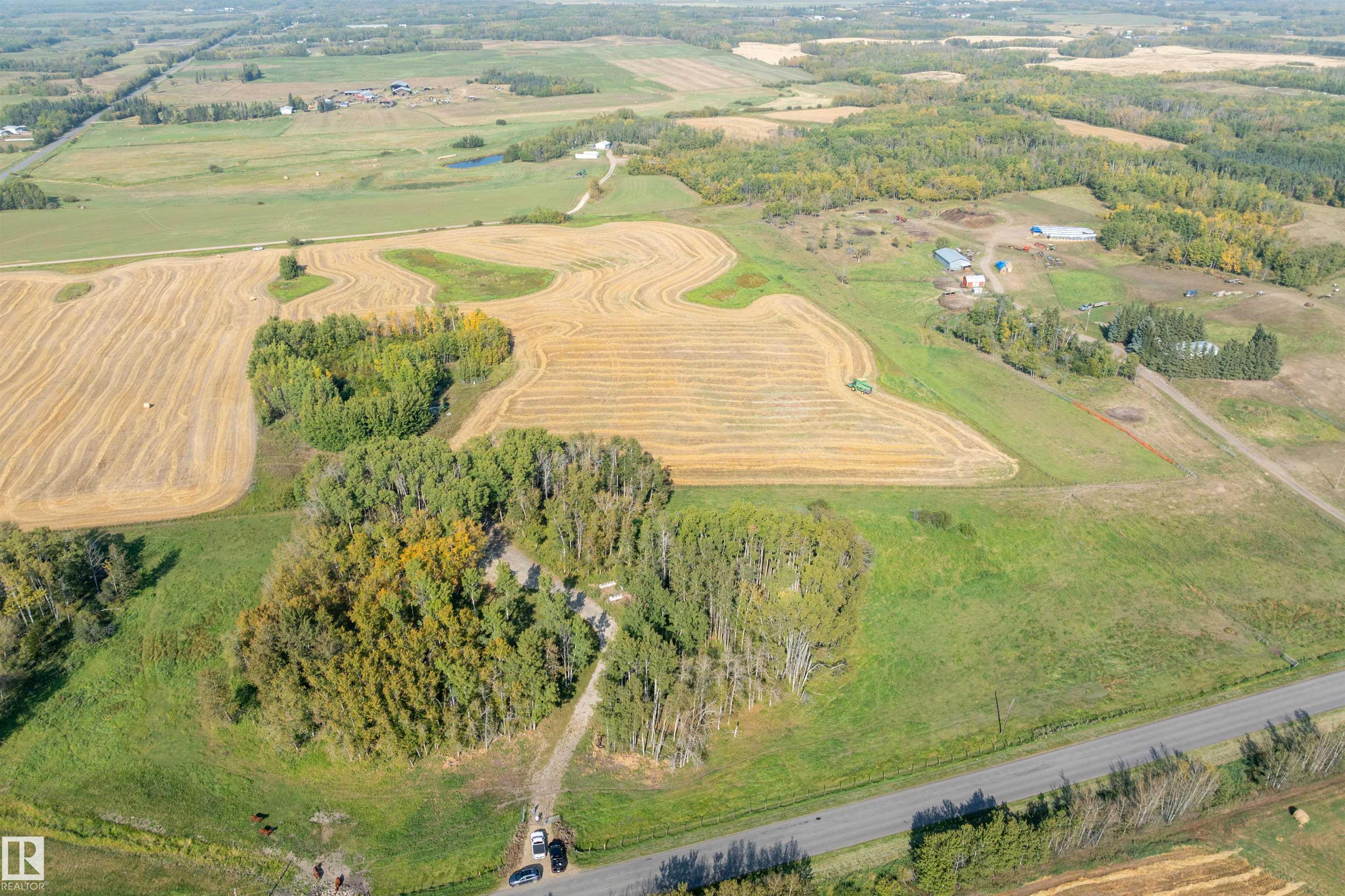 FABULOUS opportunity to own a 19.67 +/-  ACRE parcel of ROLLING, TREED & OPEN land in STRATCHONA COUNTY centrally located just minutes from Beaumont, Edmonton, the EIA and Sherwood Park. (It is less than a 10 minute drive to Beaumont.) With MULTIPLE HIGHWAYS including 50 street, Highway 21, Highway 625 & the Henday just minutes away, getting anywhere you need to go is perfect from this location. Partially in crop on a yearly lease and featuring TREED SPACES for PRIVACY and plenty of building sites offering WALK OUT CAPABILITY with AMAZING VIEWS for miles! This a great spot to create your own ESTATE PROPERTY and the possibility exists for a HOME BUSINESS OPPORTUNITY as well, with Strathcona County approval. There are TWO ADJACENT 19.67 ACRE PARCELS to sell separately or together! The approach on Township Road 510 is onto the EAST lot. There is an approach on 231 onto the West lot.