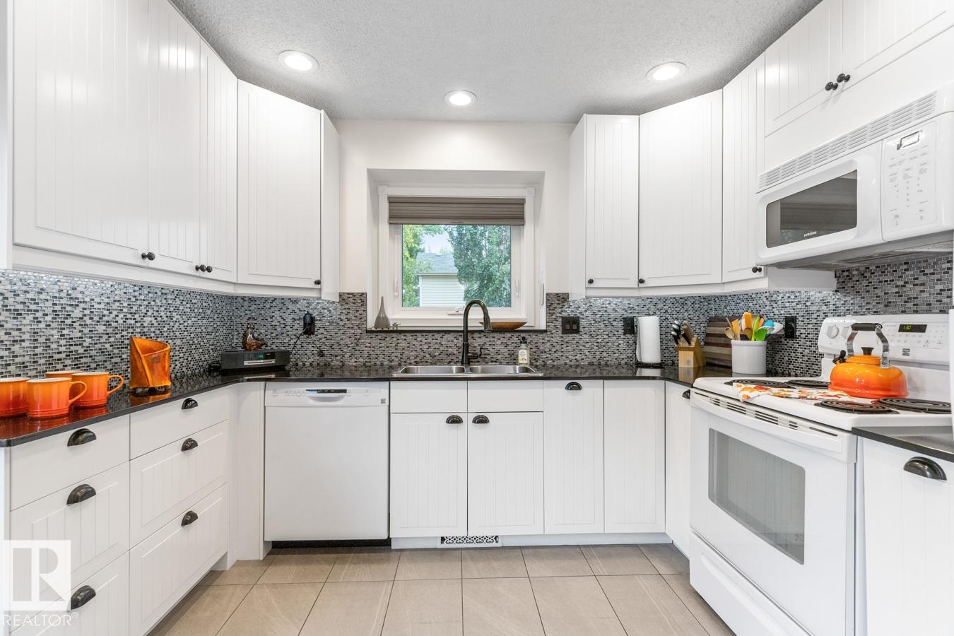 Photo 3 at 4631 10 Avenue NW, Crawford Plains, Edmonton