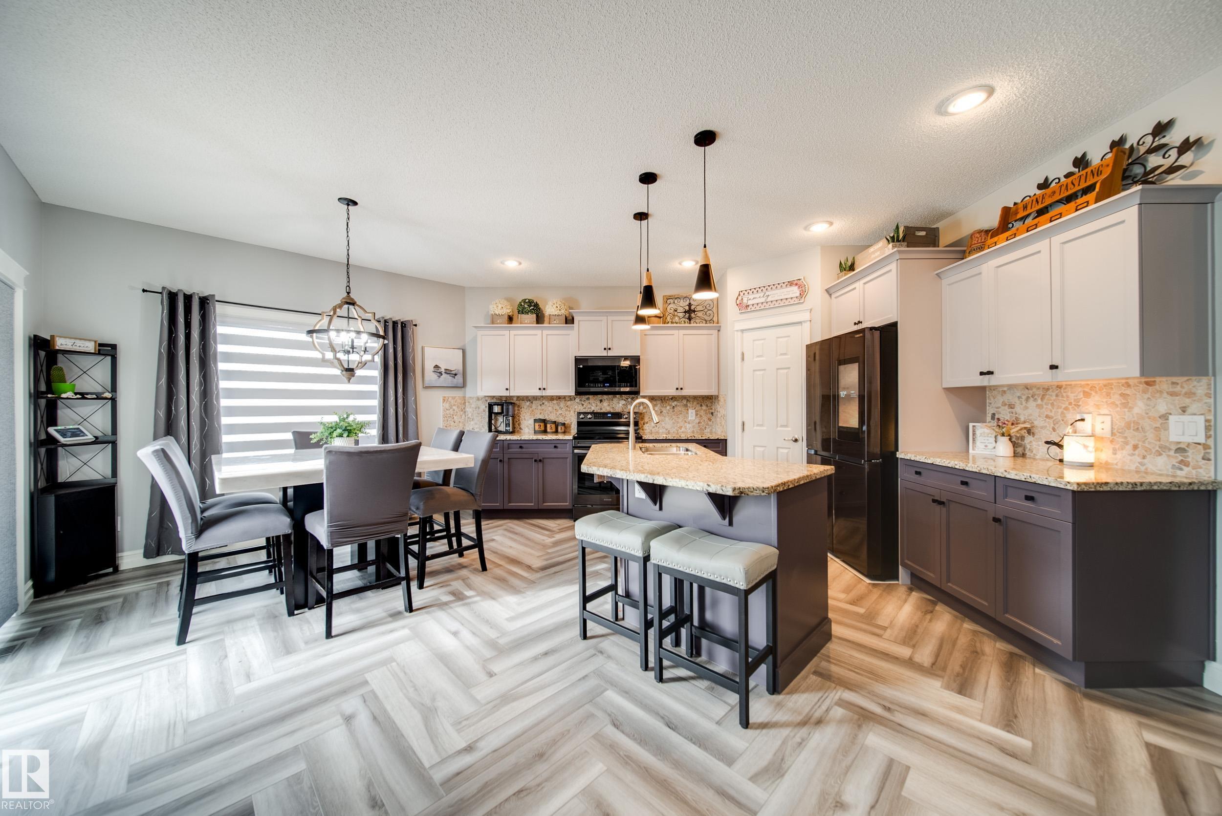 Backing onto a peaceful WALKING TRAIL, this stunning 2010 Landmark built home blends style, comfort & functionality w/over 2000 sqft of living space. Inside, soaring 9ft ceilings, herringbone LUXURY vinyl plank, & GRANITE counters set the tone. The chef?s kitchen w/plenty of prep space,storage & upgraded appliances, opens to a BRIGHT living area w/stone facing GAS fireplace & dining rm overlooking the yard. Upstairs find 3 bedrms, including a primary suite w/spa-like corner tub, abundant counter space & a WIC, plus 2 well sized rms, full bath & spacious bonus rm.The fully finished basement impresses w/a wet bar, 2nd GAS fireplace, large rec rm, 4th bedrm & full bath, ideal for the growing family or entertaining. Outside, enjoy a STAMPED CONCRETE rear deck & spacious yard w/shed. With 4 bedrooms, 3.5 baths, & thoughtful upgrades like AC & tankless HWT, this home truly has it all. Located in Charlesworth, minutes to schools, shopping, & every amenities - your perfect blend of luxury & convenience awaits.