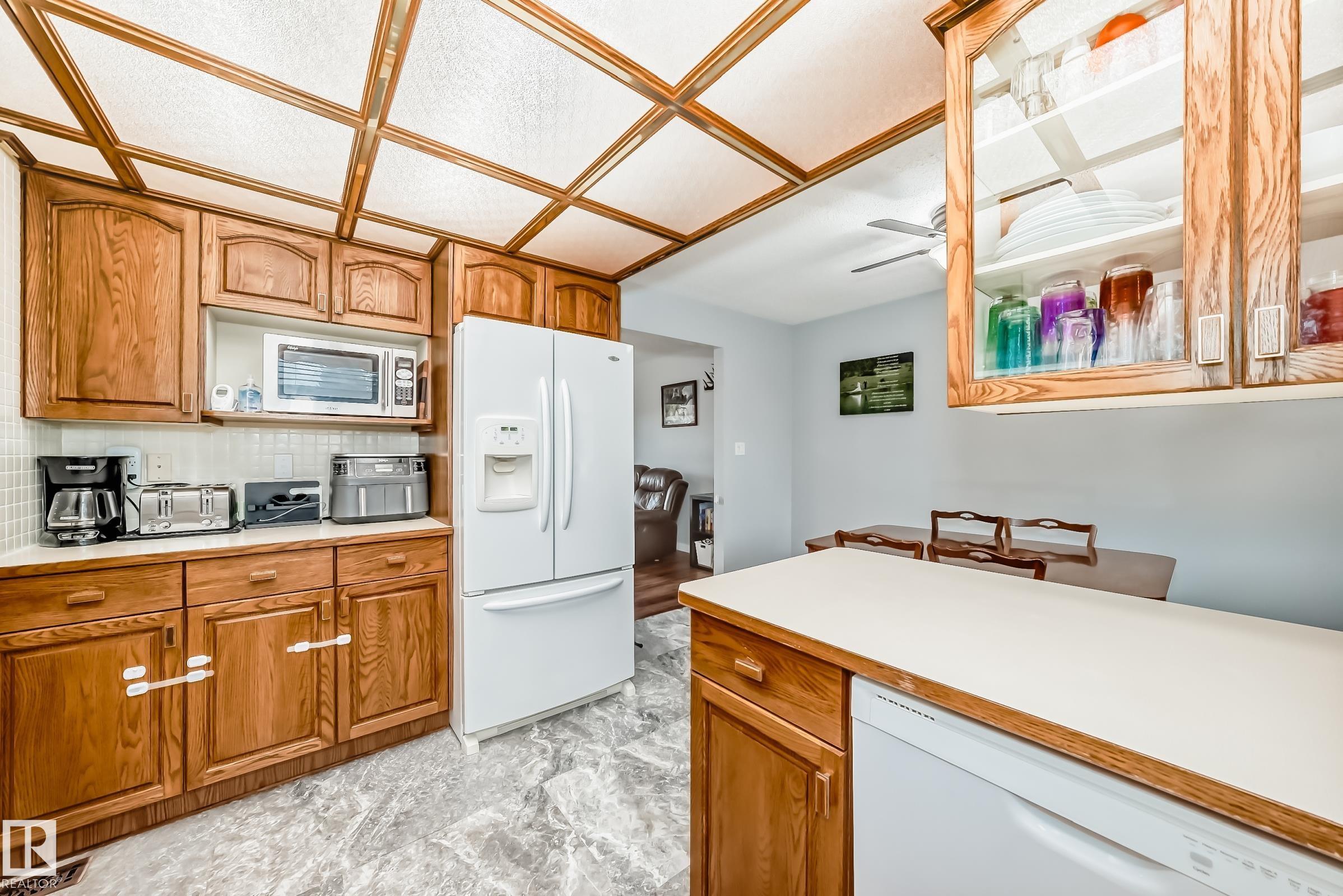 Photo 10 at 13046 32a Street NW, Belmont, Edmonton