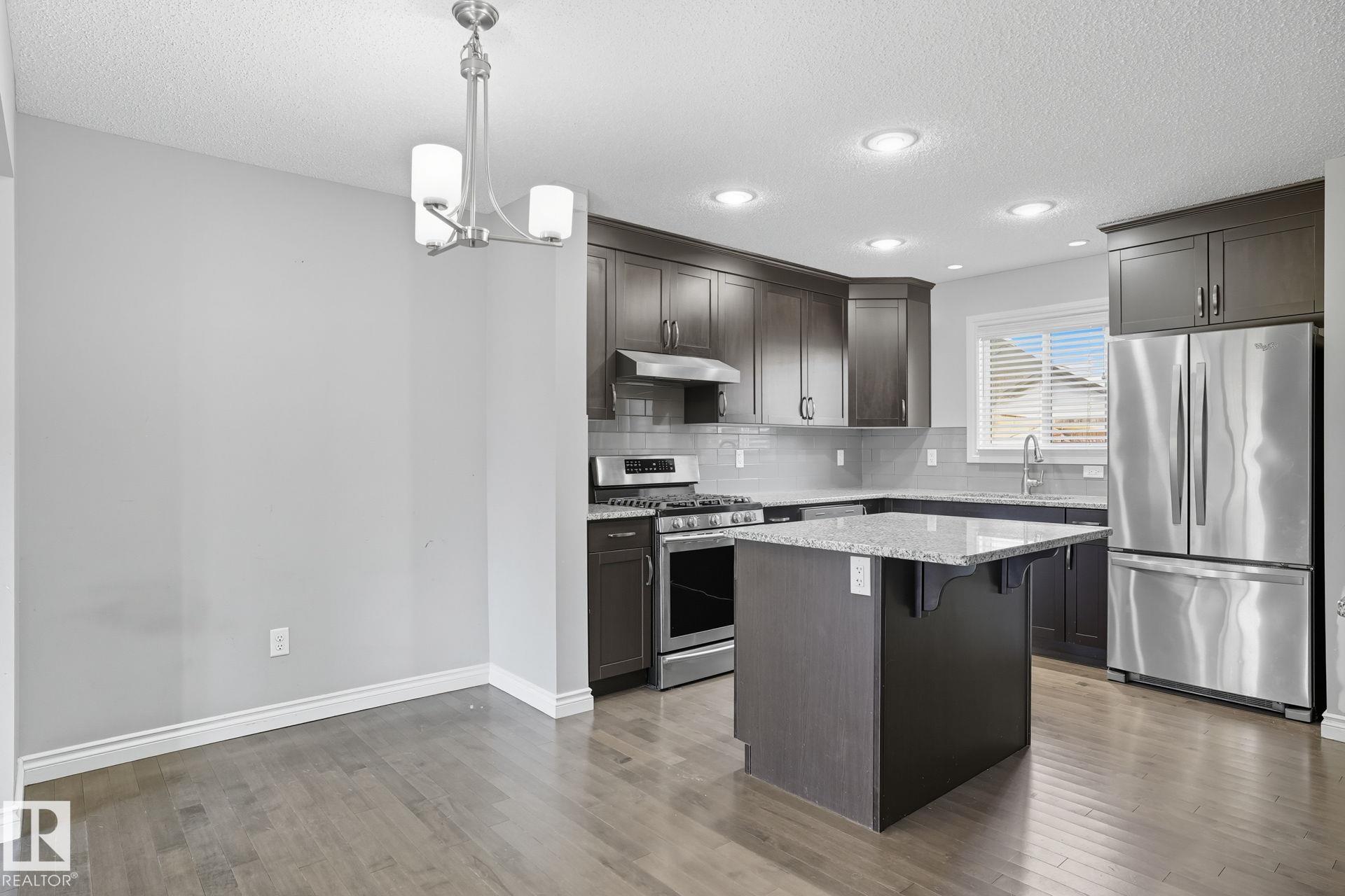 Photo 11 at 1565 33a Street NW, Laurel, Edmonton