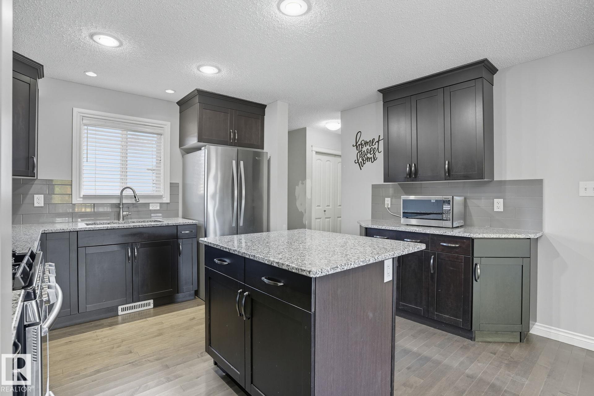 Photo 12 at 1565 33a Street NW, Laurel, Edmonton