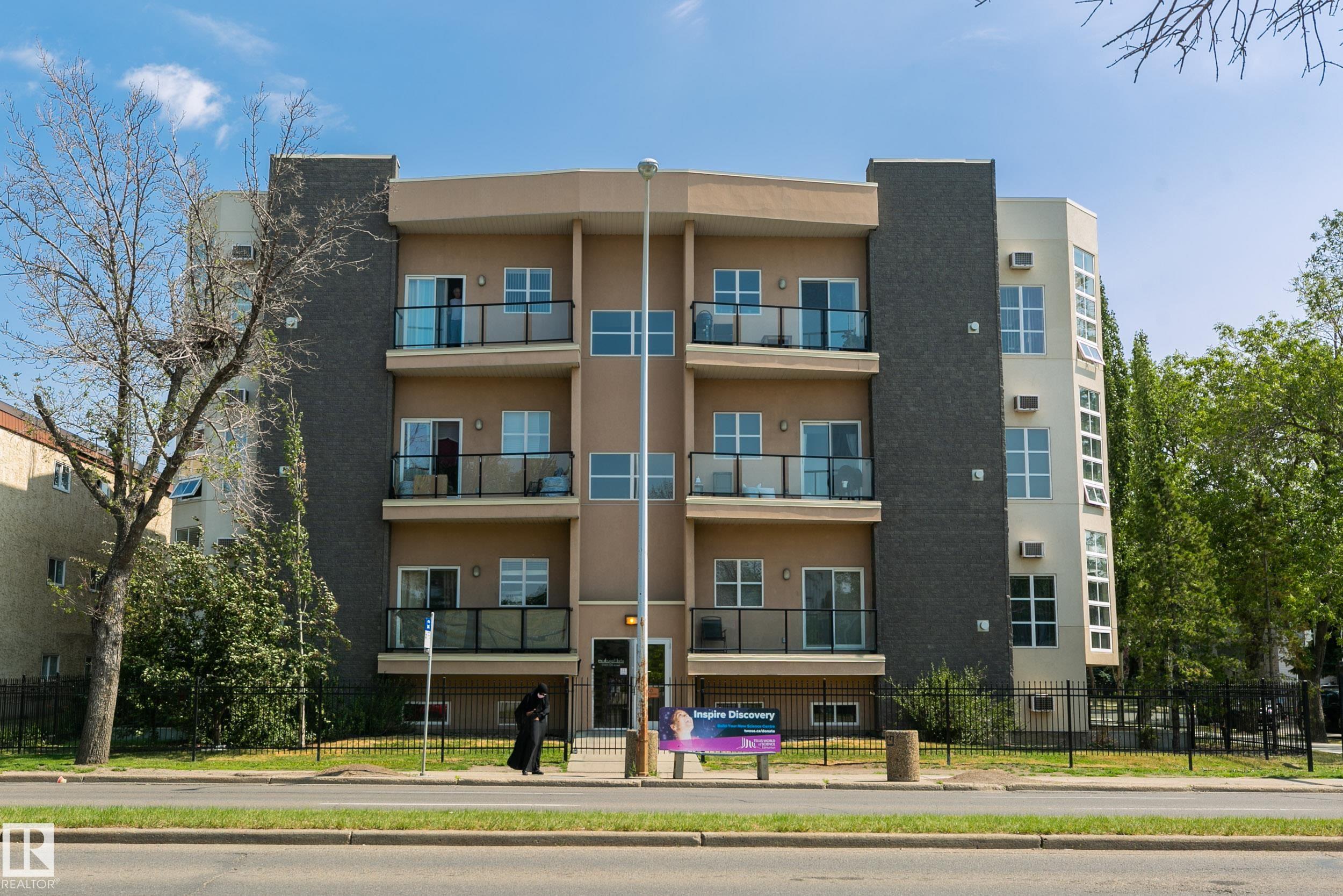 Calling ALL 1st time buyers & investors?.AMAZING opportunity for ownership in PRIME LOCATION! Welcome to McDougall Lofts with this 1 Bedroom + Den ground level unit. Well maintained complex, just minutes from MacEwan, NAIT, LRT, shopping & entertaining district (Kingsway Mall/Rogers Place/ICE District). Bus stop right out front of complex. Reasonable condo fees for maintenance free living that includes Heat, Water & one assigned parking stall. Freedom to entertain in your open concept great room featuring a gas fireplace, AC unit & raised peninsula bar in kitchen. Access to trendy outdoor concrete patio via living room & bedroom. In-suite laundry & massive closet in bedroom. STOP RENTING! This is your opportunity to jump into OWNERSHIP! YOU are going to LOVE this unit & location! MUST SEE!