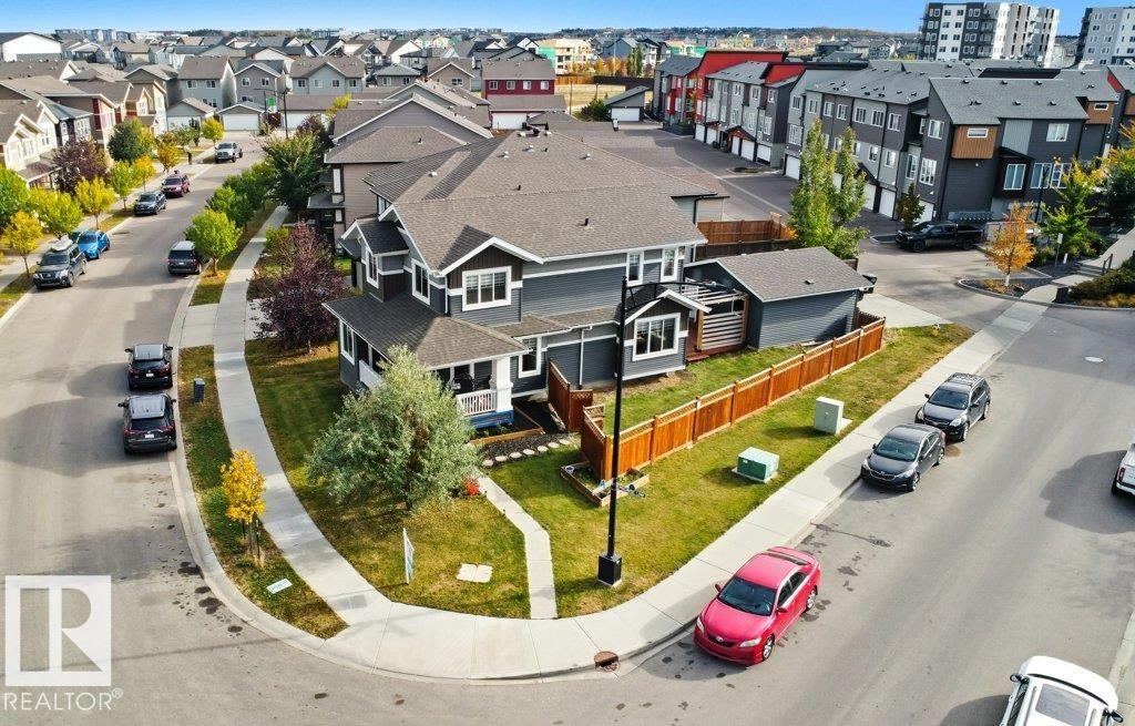 Welcome to this Beautiful Corner-lot Detached home in the highly desirable community of Paisley built on a huge 461 Sq mtr. Lot in Southwest Edmonton! This property offers fantastic curb appeal with a double attached garage, an oversized driveway, and a over sized front porch perfect for morning coffee or evening relaxation and fully landscaped lot. Extra windows adds to a tons of natural sunlight.  Step outside to enjoy the fully fenced backyard with a deck, ideal for summer BBQs and family gatherings. Inside, you?ll find a bright and inviting layout designed for comfortable living. The location is unbeatable?just minutes from major schools, shopping, parks, playgrounds, a dog park, and the airport, with quick access to Anthony Henday Drive for an easy commute anywhere in the city. Perfect for families and professionals alike, this home combines comfort, convenience, and lifestyle in one incredible package, one picture is virtually staged.