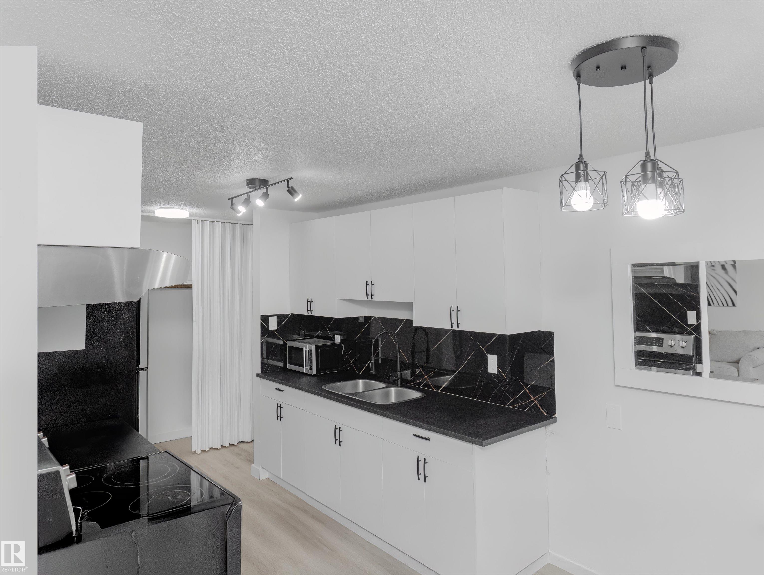 Photo 2 at 107 - 7204 81 Avenue NW, King Edward Park, Edmonton