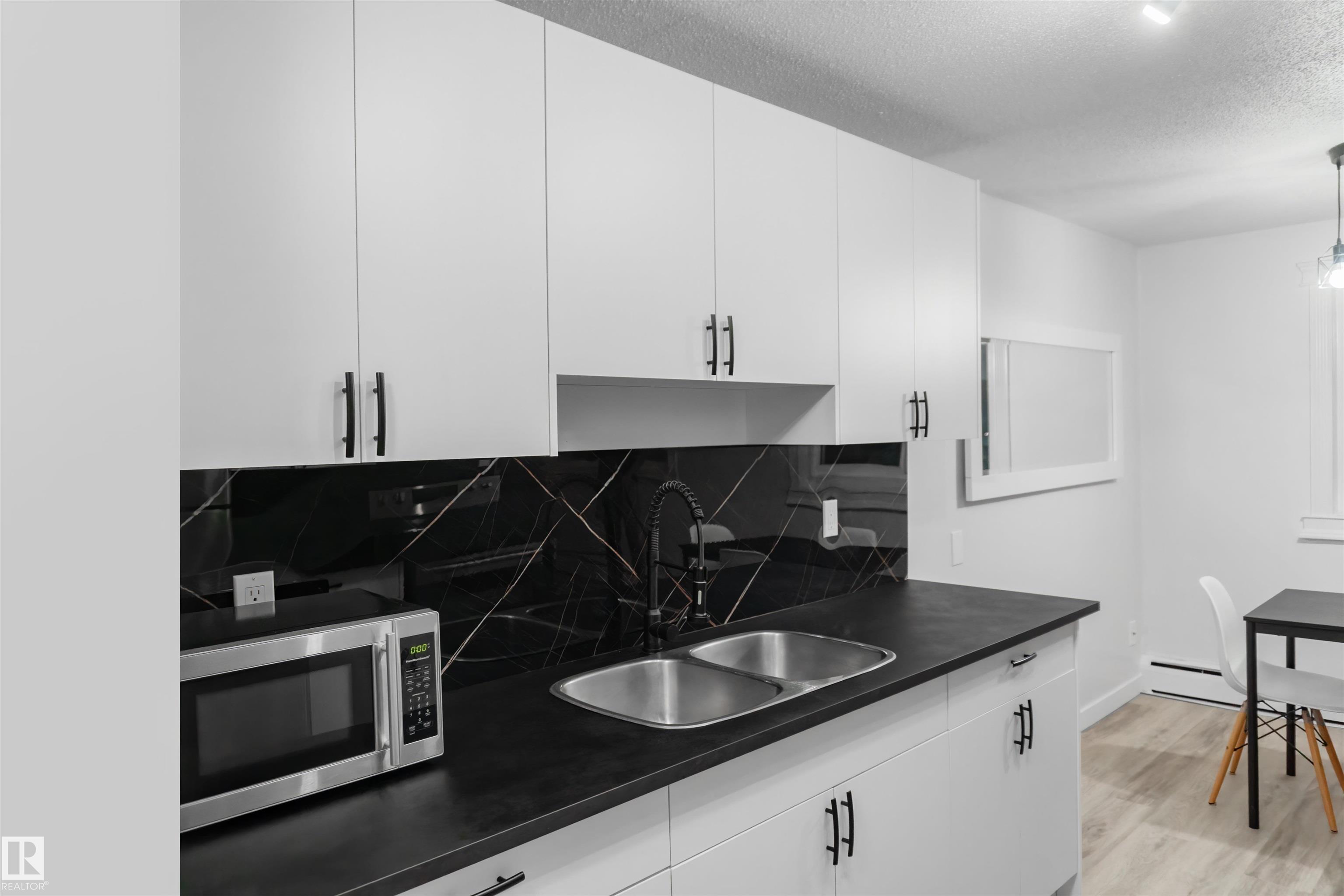 Photo 3 at 107 - 7204 81 Avenue NW, King Edward Park, Edmonton