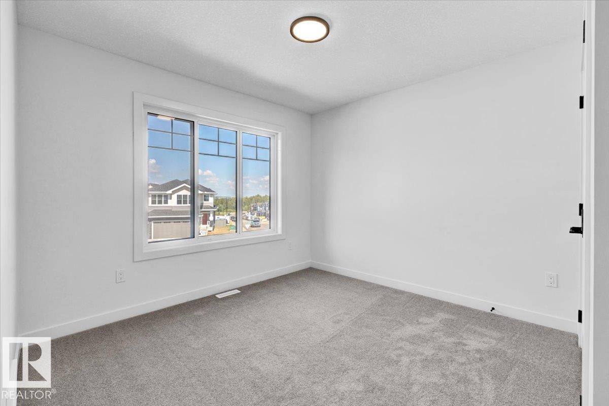 Photo 33 at 1119 Gyrfalcon Crescent NW, Hawks Ridge, Edmonton