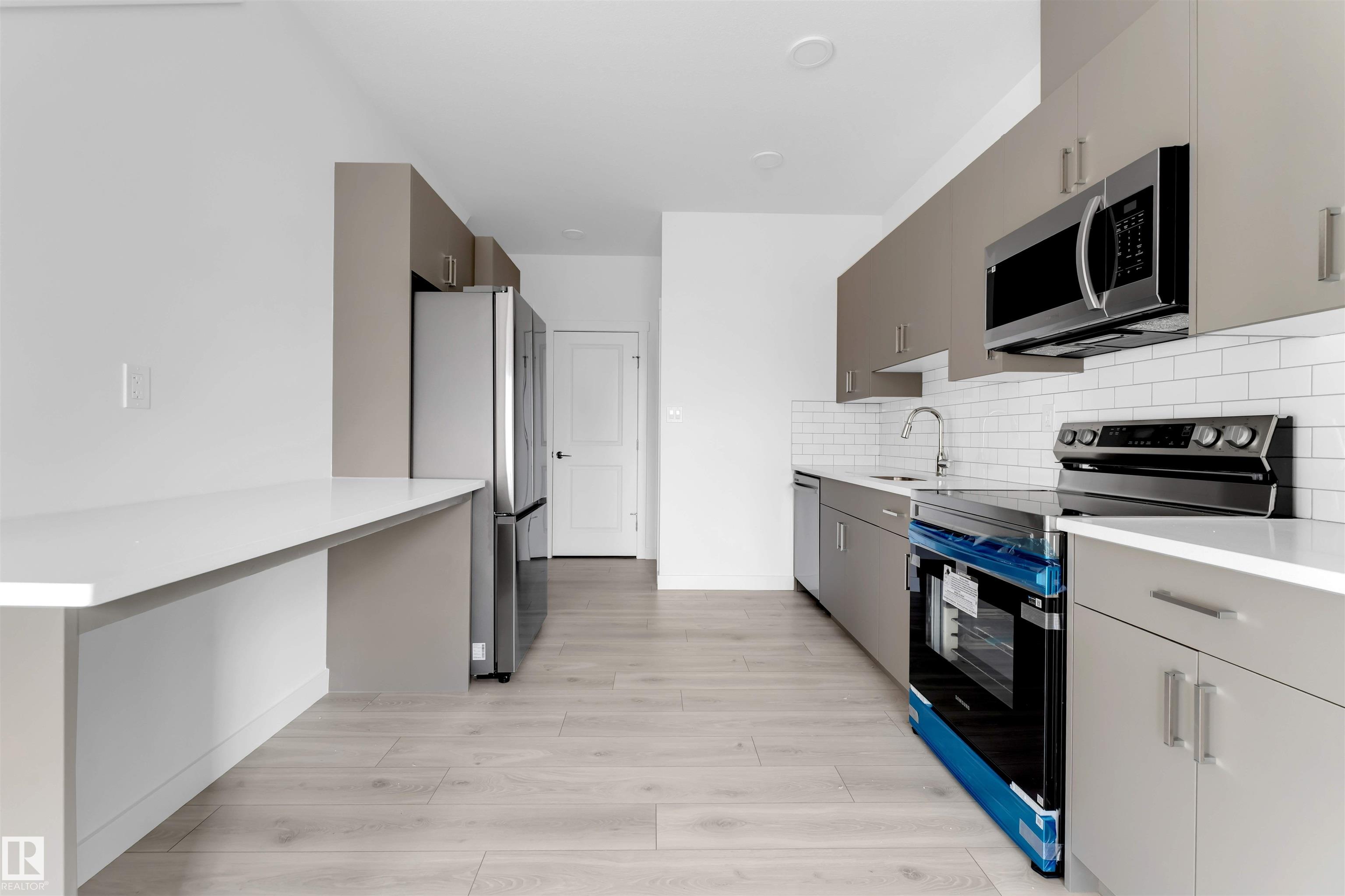 Photo 8 at 19 -  7110 Keswick Common SW, Keswick, Edmonton