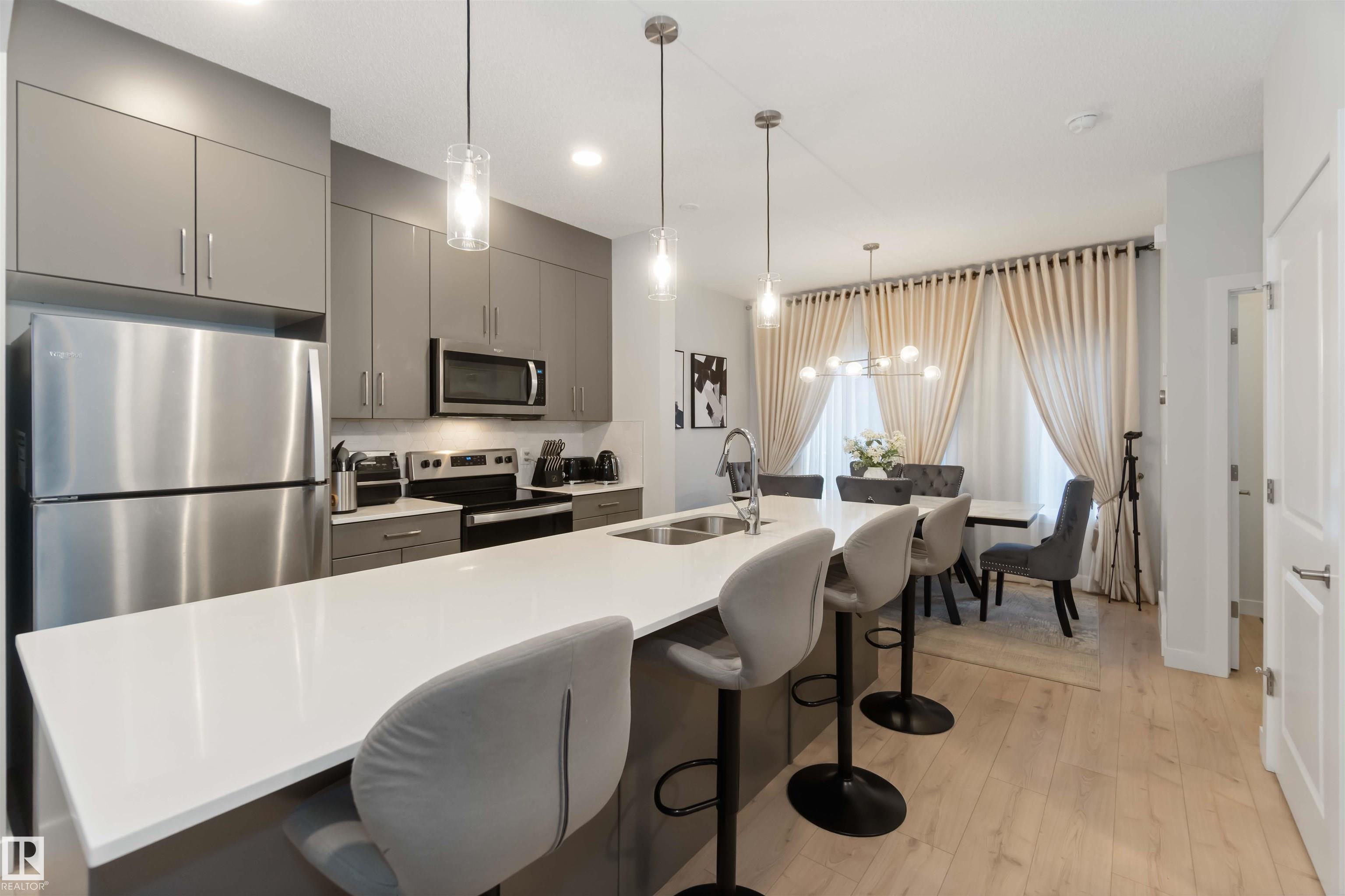 This beautifully designed three-storey townhome in the growing community of Chappelle Area offers 3 bedrooms, 2.5 bathrooms, a double attached garage, and a fully fenced west-facing front yard. Inside, enjoy 9-foot ceilings and quartz countertops throughout. The modern kitchen features stainless steel appliances, an oversized 10-foot island, pendant lighting, an eat-in dining area, and access to a spacious balcony?perfect for entertaining or relaxing. The main floor also includes a versatile den ideal for a home office, gym, or guest space. Smart home upgrades include a Nest thermostat, SkyBell doorbell camera, and keyless front entry. Maintenance-free living is made easy with landscaping and snow removal included. The community boasts over 9.8 km of walking and biking trails and is close to schools in both the EPSB and ECSD districts. Surrounded by wetlands, green spaces, parks, and water features, this home offers an ideal setting to put down roots and call a home.