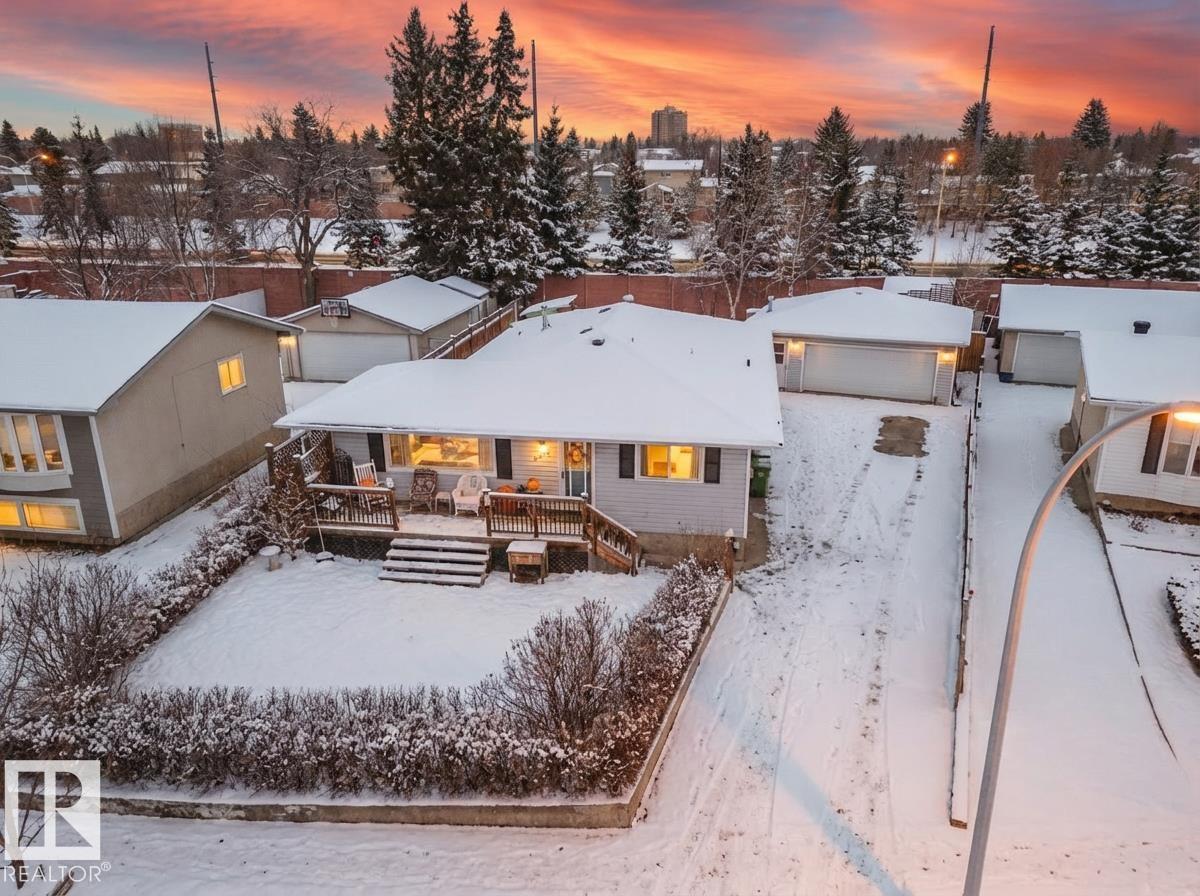 Welcome to your cozy quarters in Patricia Heights. This charming bungalow has everything you want in a family home. A welcoming living room with a cozy gas fireplace overlooks your enclosed front yard and generous front porch, perfect for a peaceful morning rocking chair coffee. The bright kitchen features large windows, a gas stove, and a spacious dining area perfect for slow weekend mornings. Three comfortable bedrooms on the main level are ideal for growing families, plus a separate entrance leads to a basement MIL suite, perfect for teenagers seeking ?independence.? The large backyard is ready for summer fires, BBQs, and playtime. The oversized double garage is a true bonus - heated, roomy, and ready for vehicles, hobbies, and ?man-crafts.? Just a few houses from Patricia Heights School, steps to ravine trails, and minutes to the Whitemud, Henday and West Edmonton Mall. Just painted, new roof in 2022, & loved and cared for by the same owners for 25 years - it?s ready for its next chapter.