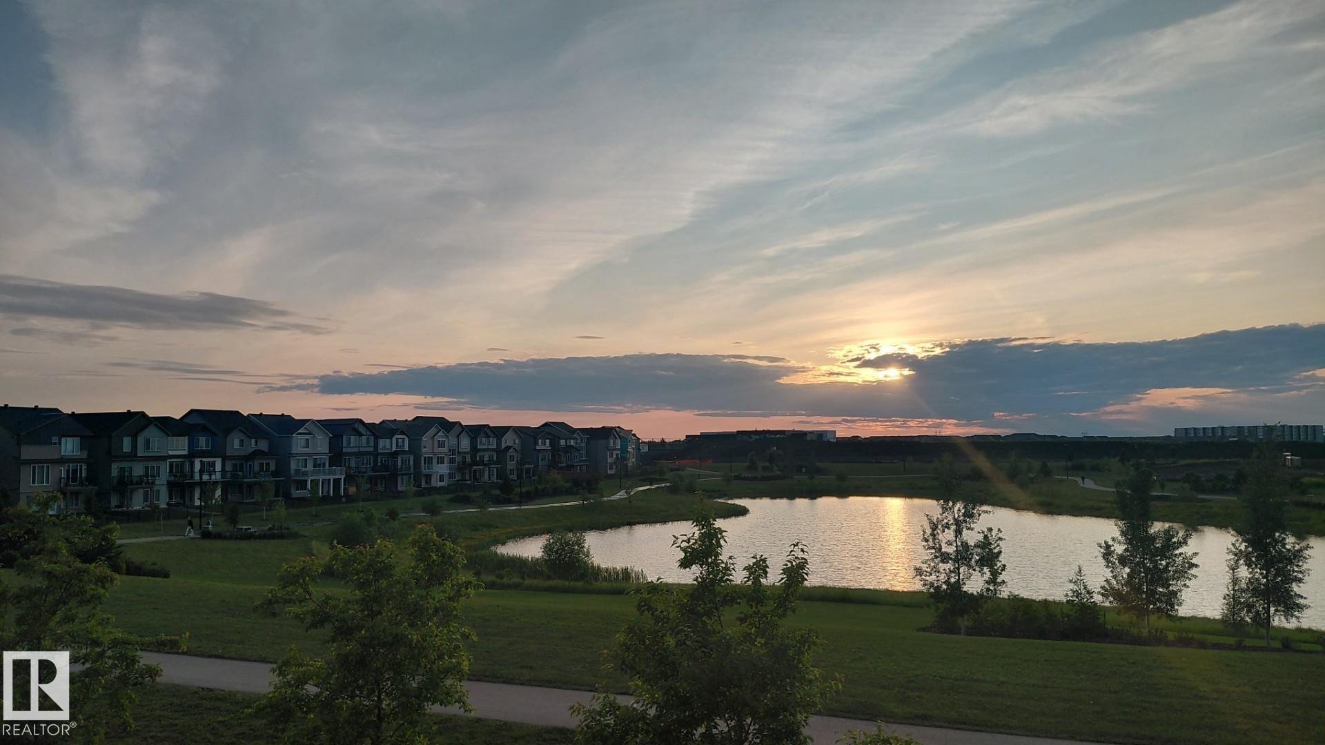 Ready to move in!�Amazing pond view modern and super clean home��in the heart of Desrochers community. This Landmark Home is thoughtfully designed to offer a blend of style, comfort, and practicality. Upon entrance you will find, spacious foyer, den,2PC bath and a mud room. Contemporary kitchen is complemented by beautiful countertops, large island, SS appliances, and a pantry. Dining area with access to balcony to savor the picturesque pond views. The open-to-above living room with large windows, fills the home with natural light and modern gas fireplace provides comfort. The stairwell leads you upstairs to a spacious bonus room with a study built in desk, laundry, 2 good size bedrooms and 4PC bath. The primary bedroom boasts a luxurious 5PC ensuite and walk-in closet.  The WALKOUT finished basement offers 9" ceiling,4PC bath, den, gym, rec room. Second laundry in the basement. Security and Sun control glass tinting coating on windows & subfloor insulation panels. Central AC.