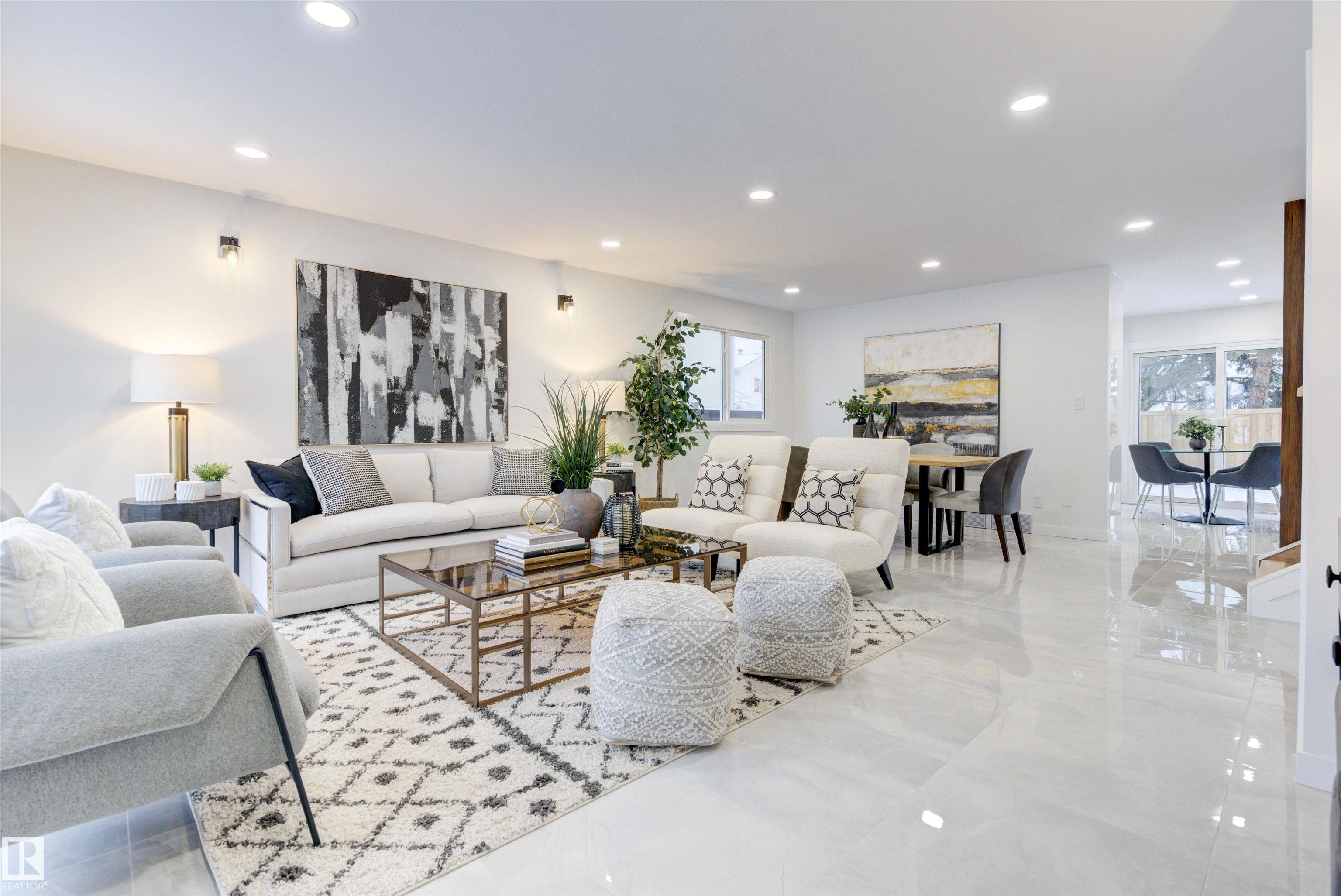 Fully Renovated 4-Level Split in quiet SE Neighborhood. This one-of-a-kind property has been completely updated inside and out, offering modern finishes and exceptional functionality for large families or multi-generational living. Brand new stucco/vinyl, parging on the house and garage, fence, deck, landscaping, all new windows, plumbing, electrical, doors, insulated attic, Furnace 2020, HWT 2025, Roof 2018.The main floor lead to  an open concept living and dining rooms. Kitchen with modern cabinets, tile backsplash, stainless steel appliances and quartz countertops. Upstairs you will find a large master bedroom with custom shower ensuite. Two additional bedrooms and 4PC Bath. On the third level� a cozy family room with electrical fireplace.�4th�bedroom and 3PC bath. The basement is fully finished with 2 bedrooms, full kitchen and laundry room with washer/dryer euro combo. Large windows fill the home with natural light. Double attached oversized garage. Close to shopping, public transportation.