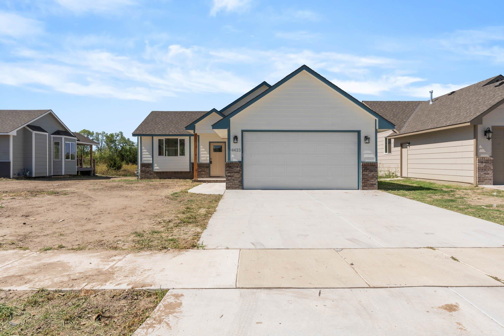 Welcome home! This 2 bedroom, 2 bathroom home, with kitchen island, 2 car garage, and covered deck, 
