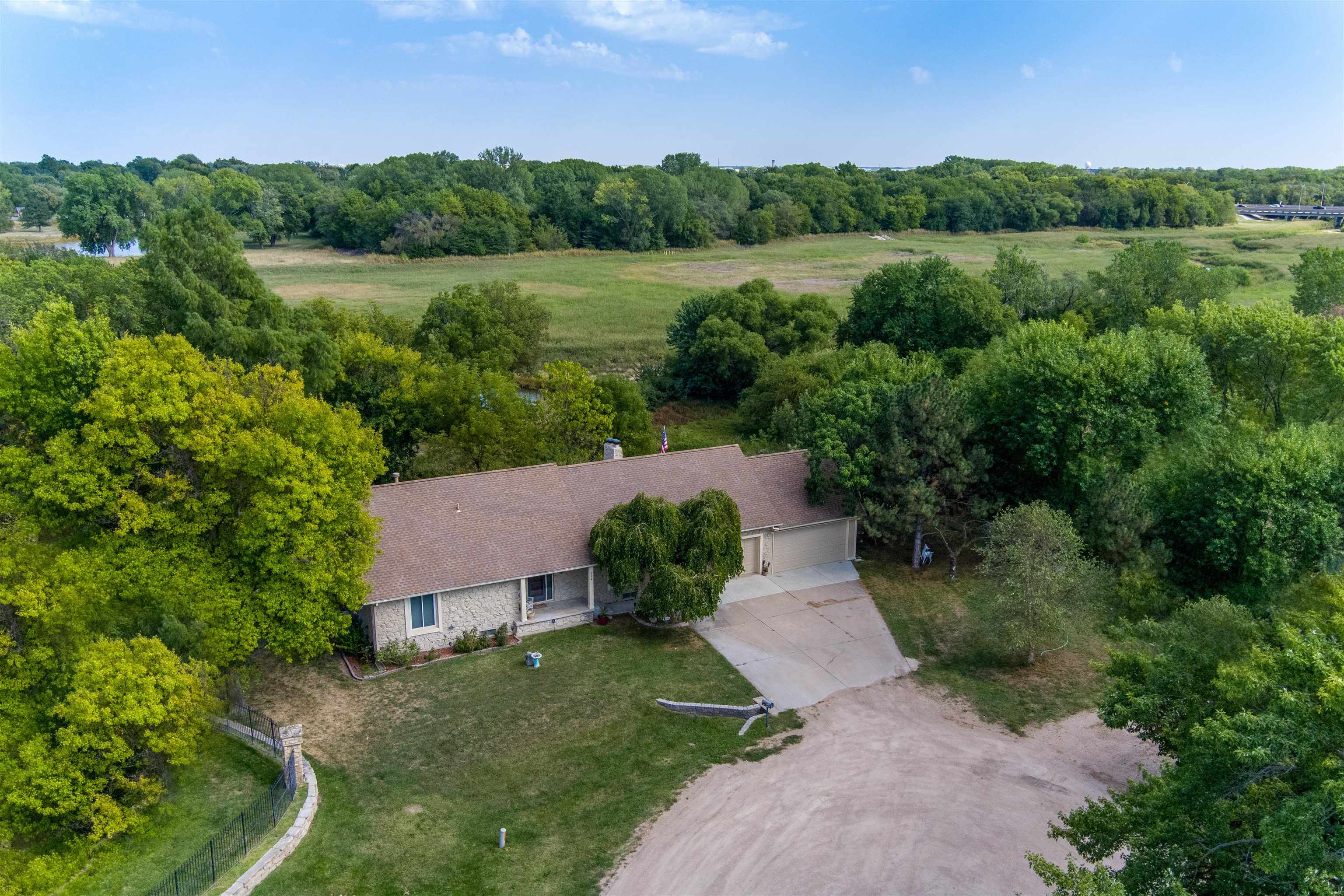 Country living in the city limits, located in West Wichita, Eisenhower School District!  This unique