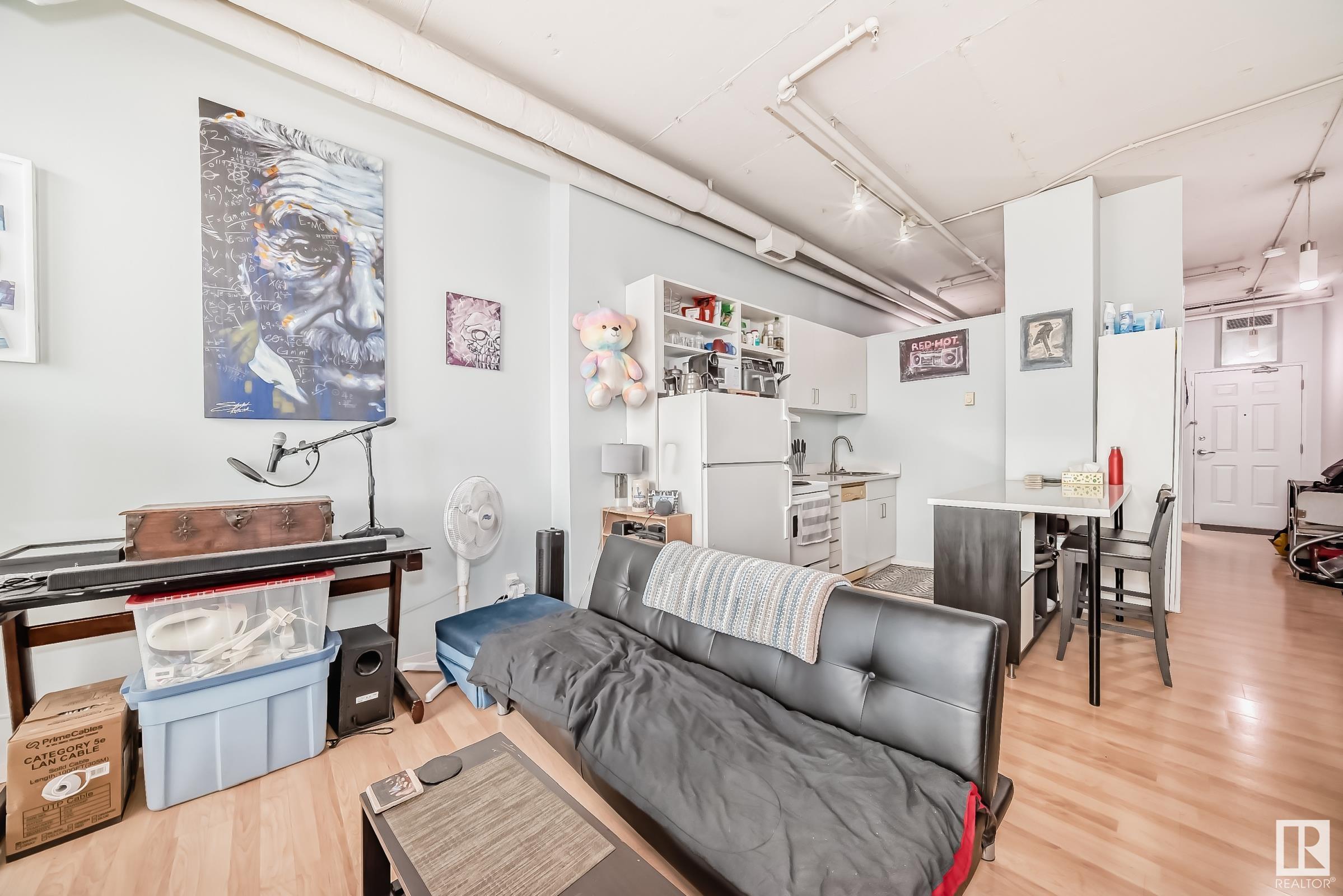 Welcome to urban living at its finest in the heart of downtown Edmonton! This modern loft offers stunning city views and an unbeatable location just steps away from the vibrant Ice District and Churchill square. This 1 bedroom, 1 bathroom home features an open concept layout with high ceilings that create an airy and spacious feel. The central LRT station is conveniently accessible right from the building, making it easy to explore all that downtown has to offer. Whether you're a young professional looking for a trendy urban oasis or a couple seeking the ultimate in convenience and style, this downtown loft is sure to impress. Steps from the funicular, River Valley trails & City Centre Mall.