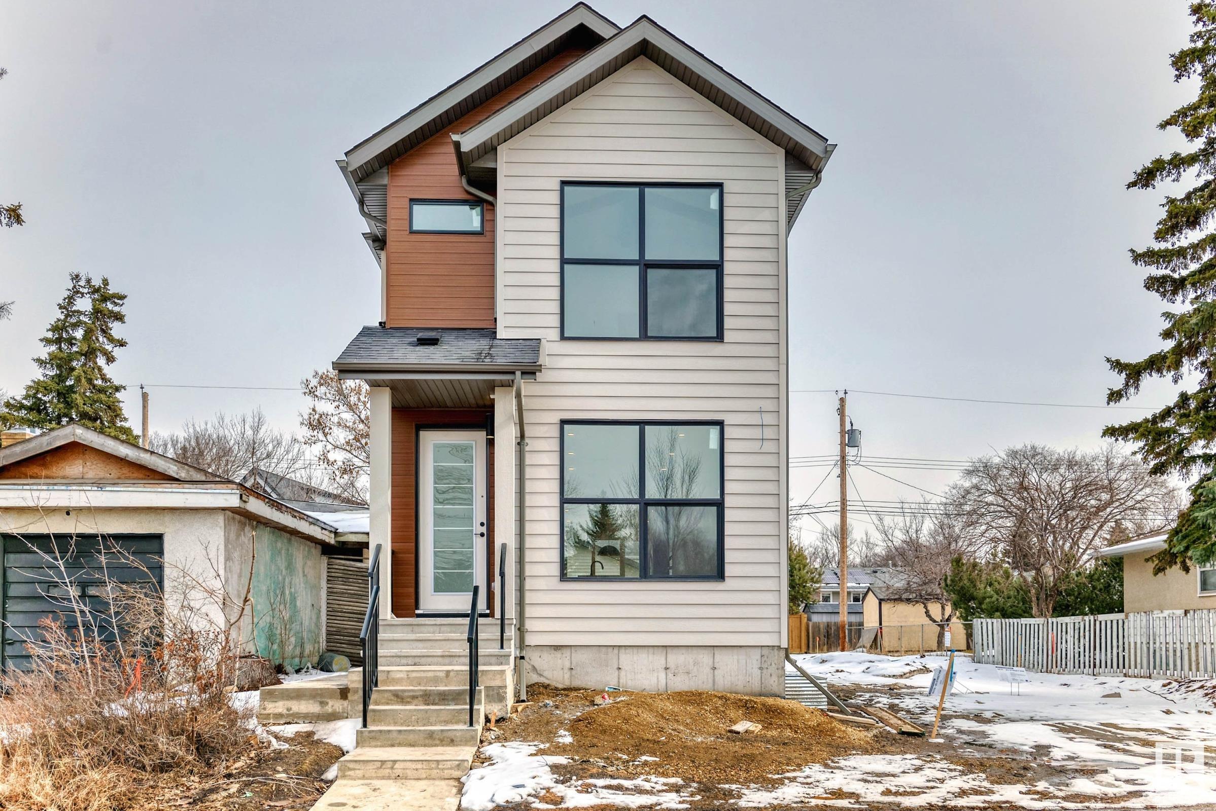 Stunning new infill with views of the Edmonton River Valley & Downtown, close to schools, parks & the LRT. This 2-storey style home boasts over 1812 sq.ft., with an open & bright plan, thoughtful selection and exquisite finishing. The spacious kitchen has a large island, 2-tone cabinetry, quartz counters & s/s appliances. The living and dining areas have designer lighting, fireplace, 9' ceilings & wide-plank engineered hardwood. As you proceed upstairs with the modern oak handrail to guide you, a primary suite awaits with vaulted ceilings, gorgeous views, walk-in closet & 5-piece ensuite with freestanding tub + separate shower. There are two more spacious bedrooms on this level, plus a full 4-piece bath and large laundry room. Complete the package with: full landscaping; triple pane windows; tankless hot water; Hardie plank; HRV; separate entrance to basement; deck; & a double detached garage. Close to schools, shopping, transportation & walking distance to great Edmonton festivals & river valley trails.
