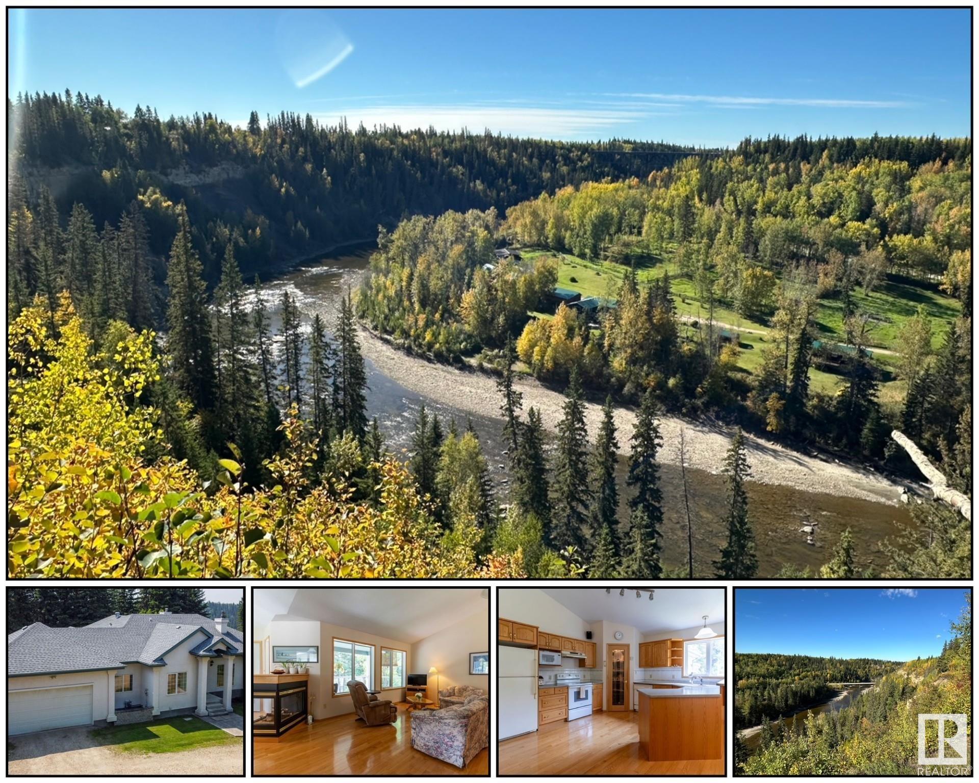 Stunning bungalow on 10.87 acres within the town of Entwistle. You can  enjoy the breathtaking view of the Pembina River right outside your back dr. This home features 3 bdrms, 3.5 baths, and a fully developed bsmt. The spacious entrance & liv rm both boast in-floor heating. The great Rm showcases an open concept with vaulted ceilings, a 3-sided gas fireplace, & hardwood flooring. A garden dr opens to a lg deck overlooking a beautiful, treed paradise. Down the hall, a 4-piece bath separates the primary bedroom with a 6pc ensuite from a secondary bdrm. The lower level invites relaxation for the family with a wood stove, perfect for our cold winters. A lg recreation Rm provides ample space for family time, complete with a 3pc bath and a 3rd bdrm. The bsmt has been conveniently roughed-in for a future in-suite with separate laundry & a cold rm. The O/S dbl garage has in-floor heat & storage. Additional conveniences include a nearby school for grades 1-9, city water/sewage & the potential for subdividing.