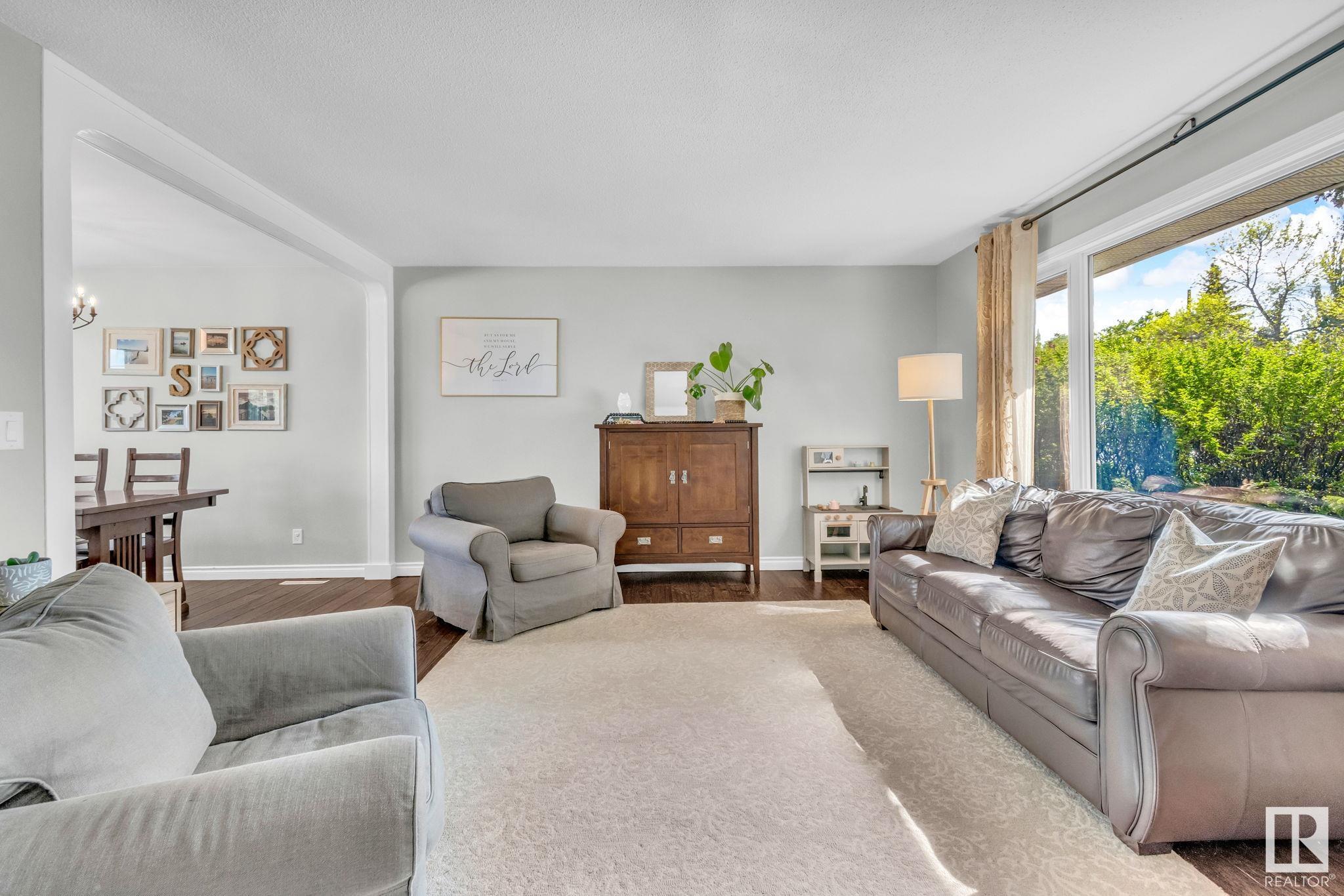 Discover the charm of BUNGALOW living with this elegant 5-bedroom family home in prestige OTTEWELL! Bright large windows illuminate the living room, complementing the HARDWOOD FLOORING throughout this carpet-free home. The RENOVATED KITCHEN boasts QUARTZ COUNTERTOPS, SS APPLIANCES and ample cabinetry for effortless organization. The main floor features a spacious master bedroom with a generous closet, alongside two additional bedrooms and a RENOVATED BATHROOM. The basement offers a cozy retreat with a stone-facing fireplace, an oversized bonus room, two extra bedrooms, another full bath and it awaits your flooring touch. Outside, enjoy a deck and patio, complemented by full landscaping. Notable upgrades include windows, hot water tank and a newer roof. A large detached DOUBLE GARAGE and RV STORAGE space next to it complete this fantastic property. Located minutes from parks, transit, top-rated K–12 schools and King’s University, this home is an ideal choice for families seeking comfort and convenience!