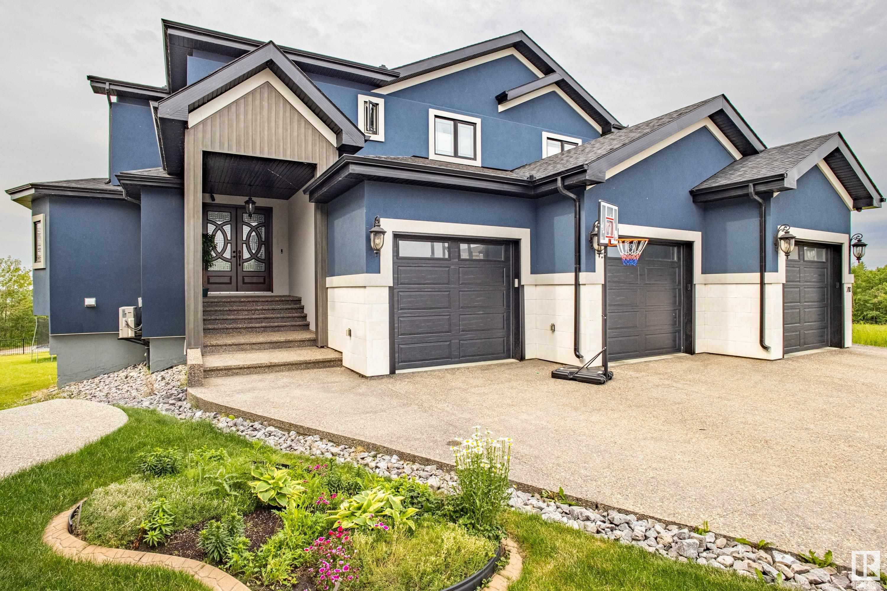 Experience the pinnacle of luxury & energy efficiency in this extraordinary home built by award winning builder, Net Zero Development. This executive estate home offers over 4000sqft above grade, plus a fully finished walkout basement with amazing views backing the River. This home combines striking architectural detail with thoughtful sustainability, featuring solar panels, upgraded insulation & a triple garage complete with two EV chargers. Inside, you'll find a show-stopping gourmet kitchen with high end cabinets & countertops outfitted with top-tier appliances, premium finishes & two oversized islands, perfect for both entertaining & everyday living. The open-concept layout is drenched in natural light, highlighting the craftsmanship throughout. Every room speaks to quality & comfort. Heated tile floors throughout. The fully finished walkout basement expands your living space with seamless access to the outdoors, ideal for hosting or relaxing.