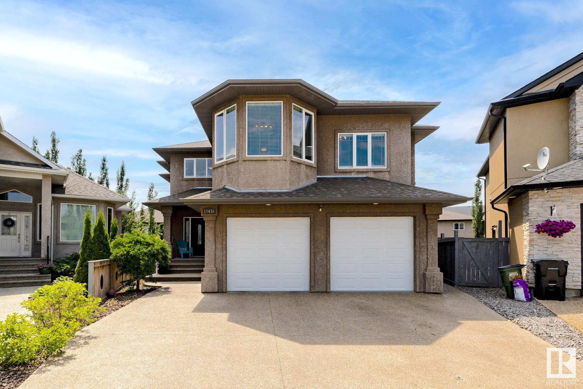 5 BEDROOMS. Beautiful 2 storey family home on a private cul-de-sac lot in Chambery, steps to the lake, park & walking trails. Over 4100SF of developed living space w/ open concept environment. Main floor features a large kitchen w/ maple cabinets, granite counters w/ center island breakfast bar overhang, pendulum & flush mount lighting. Formal dining space w/ glass doors, living room w/ niched & mantled gas fireplace blended w/ eating nook. Convenient main floor laundry & 2 piece granite powder room. Upper level features a bonus room, 4 bedrooms, 4 piece granite bathroom w/ spacious primary bedroom sporting a spa style 5 piece granite ensuite w/ 2 walk-in closets. Basement is outfitted for in floor heating with large rec room, 5th bedroom, 4 piece bath, granite wet bar w/fridge. Garage connects to spacious storage room in the basement. The SW facing beautifully landscaped backyard is private & tranquil w/ slated fire area. Exposed aggregate driveway & walk way. Complete w/ solar panels & AC. A PURE GEM.
