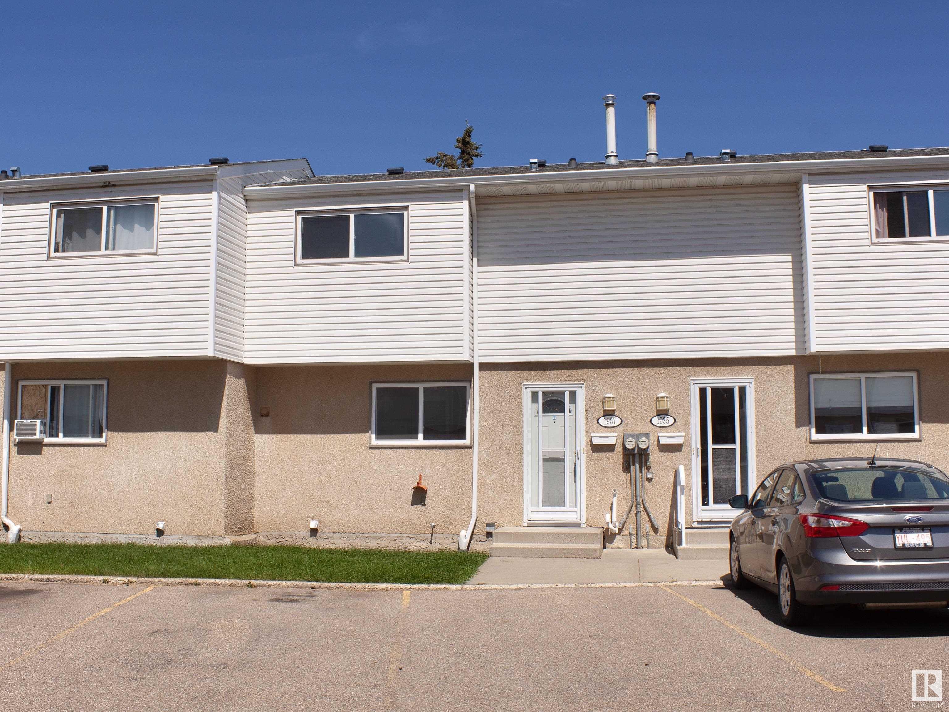 Charming townhouse condo in the Ekota community! This well-maintained home boasts 3 spacious bedrooms and a 4-piece bathroom on the top floor. The main level features a cozy living room with direct access to a private fenced backyard, plus the combined kitchen and dining area. The finished basement offers a large family room, a 3-piece bathroom, and a convenient laundry room. Ideal for families, this home provides comfort, functionality, and a great location near amenities. New flooring and fresh paint throughout the first and second floors as well as a new furnace is 2024. The home also has one parking spot directly out front and one behind.