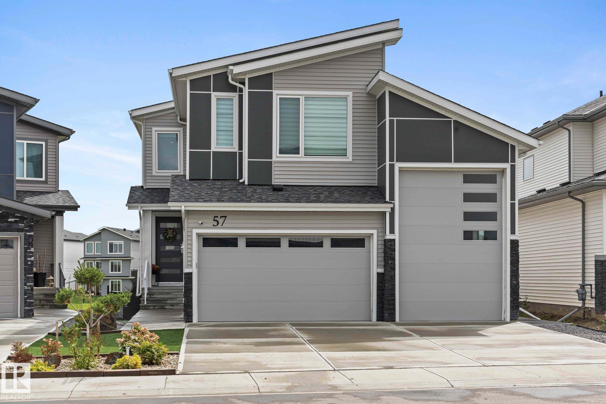 Stunning 2-storey walkout Victory Home, built in 2022 offers over 2,600 sqft with 3 beds & 2.5 Baths and is designed to impress! The open-concept layout with soaring ceilings offers elegance and space from the moment you enter. Love to cook and entertain? The chef’s dream kitchen with Gas Cook Top & Wall Ovens also features a large island with Waterfall Counter tops, pantry, and buffet counter—perfect for gatherings. Main floor includes a den/office or 4th bedroom & Half Bath. Upstairs, the primary suite boasts a 5-piece ensuite, walk-through closet & Private Balcony with serene lake views. Loft Area 2 more spacious bedrooms, full bath, and convenient laundry Room complete the upper floor. Enjoy incredible upgrades: Heated Triple Garage with RV-Height door, A/C, Stamped Concrete Patio, low-maintenance yard with Artificial Turf & limestone, Composite Fence & Gates. Immaculately Maintained—A perfect home for family living—luxurious, functional, and move-in ready!
