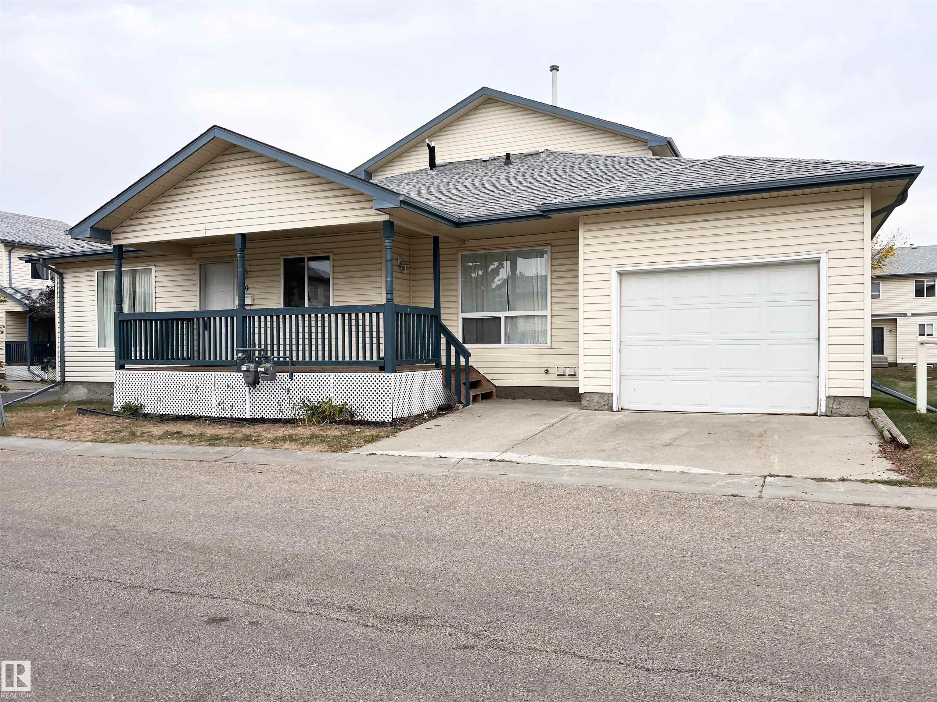 Charming Bungalow Townhouse in Central McDougall located conveniently near Kingsway Mall, the Ice District, The Royal Alex/Glenrose Hospital, NAIT/Grant MacEwan/Vic Com, Parks/Playground/Splashpark, Schools, LRT and Local Eateries. Wonderful and spacious main floor plan with open concept environment, oak kitchen with ample roll out cabinetry storage and island breakfast bar, dining room and living area with mantled gas fireplace and vinyl plank flooring. 2 bedrooms with 3 piece main bath and 2 piece ensuite in the primary bedroom with walk in closet. The basement offers a huge family room or recreation room with a 4 piece bathroom and laundry area with wash sink. Spacious veranda and single insulated attached garage with built in work table. Complete with all appliances and window coverings. Furnace (2019) Tankless Water Heater (2019), Roof (2018). Delightful and Carefree living with all the perks.