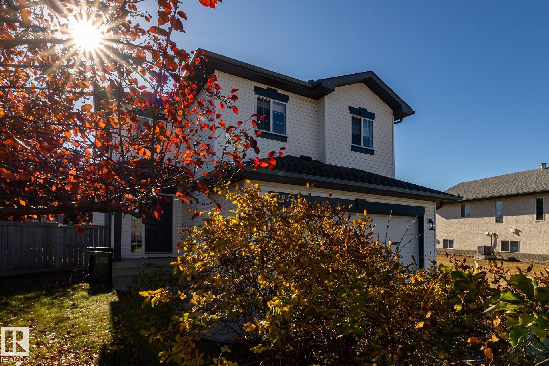 This clean, bright & spacious, open-concept, two storey situated on a quiet, residential street in Elsinore offers all the features and conveniences you could hope for in its price range, including a heated garage, air conditioning, fiinished basement & a private oasis in the backyard. Main level has a welcoming entrance way, great room with re-finished hardwood flooring & gas fireplace, island kitchen with breakfast counter, dining area, half bath & laundry. Upper level features a bonus room, family bathroom, 3 bedrooms including a primary with walk-in closet & an esuite with a corner jetted tub. Basement is host to a recreation room with wet bar/kitchenette (small fridge, microwave, sink & counter space). The gorgeous, large, fenced and landscaped backyard provides plenty of room to play & entertain plus has a deck, garden, mature trees, storage shed, fire pit & a pond with waterfall. Home has easy access to schools, shopping, restaurants, coffee shops & the Anthony Henday Drive. Act fast!