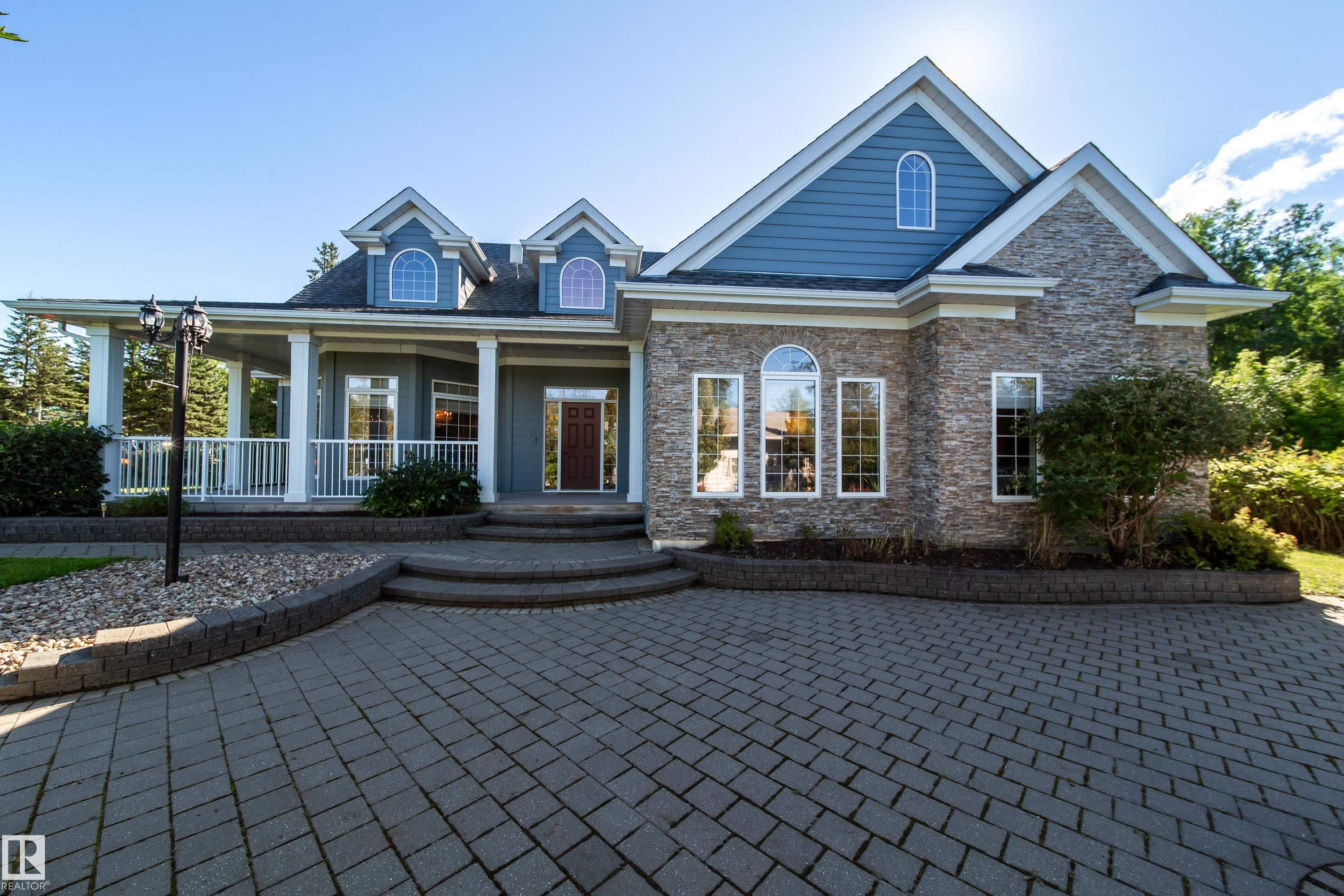 Luxurious Lakeside Living at Silver Beach Highly motivated sellers. Quick possession. This custom-built bungalow offers 2,785 sq.ft. of refined living space,including a finished loft, 3 bedrooms + office, 2.5 baths, and a heated double garage, all on a beautifully landscaped 1,638 sq.m. lot. Enjoy cherry hardwoodfloors, a gourmet kitchen, automated blinds, and a spacious living room with gas fireplace. The main-floor primary suite features copper sinks, customcabinetry, and French doors to the patio. Relax in the sunny backyard with hot tub, waterfalls, and a large deck, perfect for summer evenings. This isn?t justa house. It?s your next chapter. Come explore and you might just fall in love.